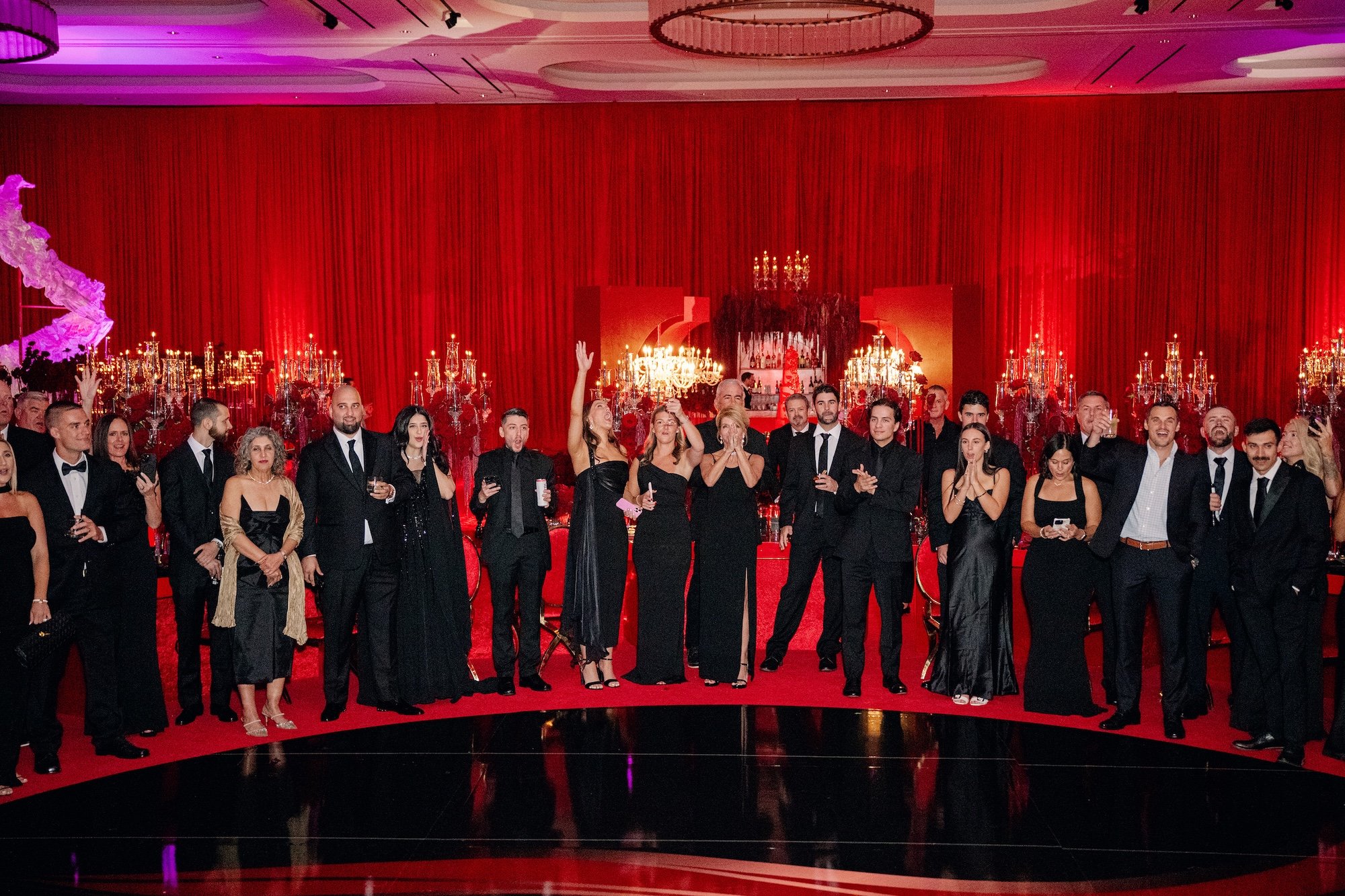 Full dance floor at a red and black modern wedding reception at Fontainebleau Las Vegas.  Luxury Las Vegas Wedding Planner Andrea Eppolito.