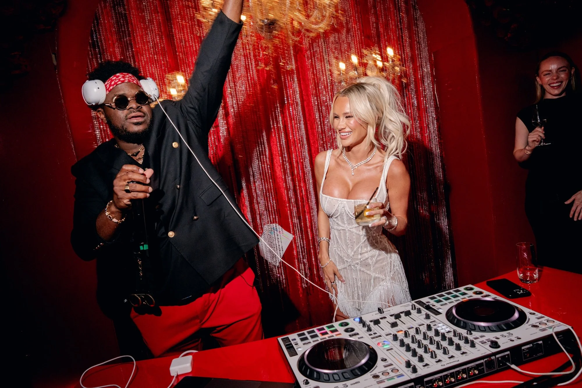 Bride with DJ Malike at a luxe Las Vegas Wedding.  Red and black modern wedding reception at Fontainebleau Las Vegas.  Luxury Las Vegas Wedding Planner Andrea Eppolito.