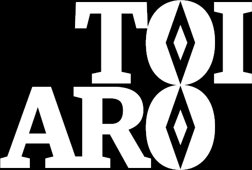 The wors 'Toi Aro' offset verically in white writing on a black background.The 'O' of each are lined up and have a double diamond shaped motif instead of a circle, making it have a Pacifica feel.