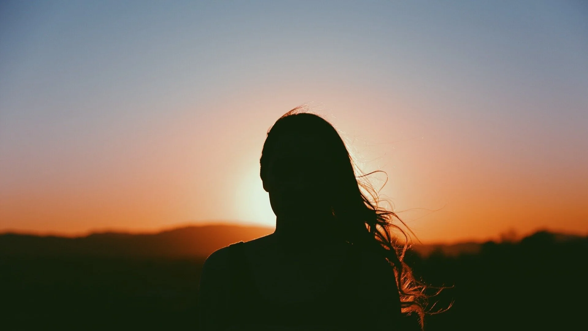 Woman watching sunset