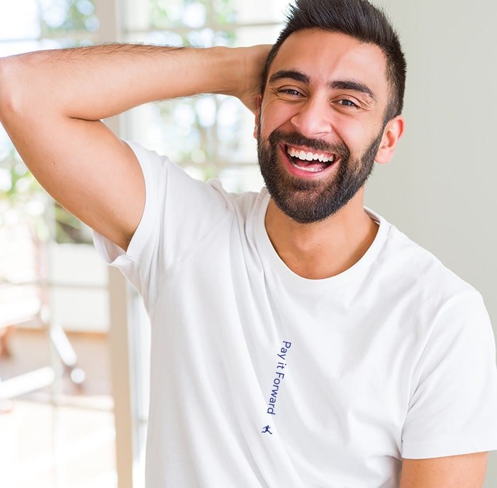 A super soft white tee that could almost be plain, but it isn't. Because in the center of the shirt is a minimalist message that reads "Pay it Forward". The guy looks so happy to be wearing it!