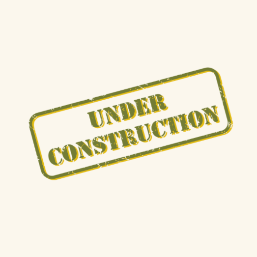 Green and yellow 'Under Construction' sign with distressed look on a light background.