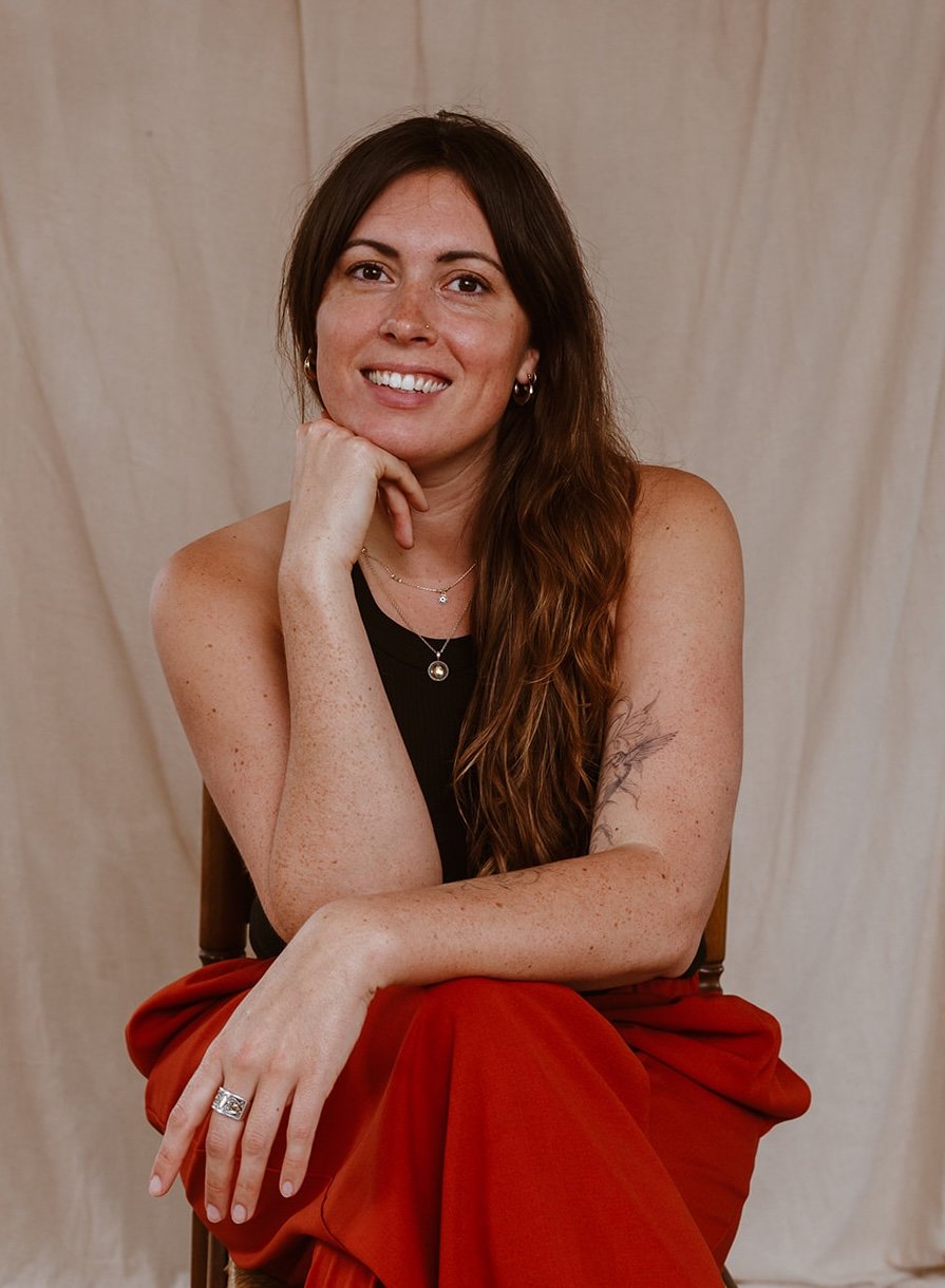 Joanna Hamilton, somatic hypnotherapist in Bristol, seated in a warm, grounded therapy space