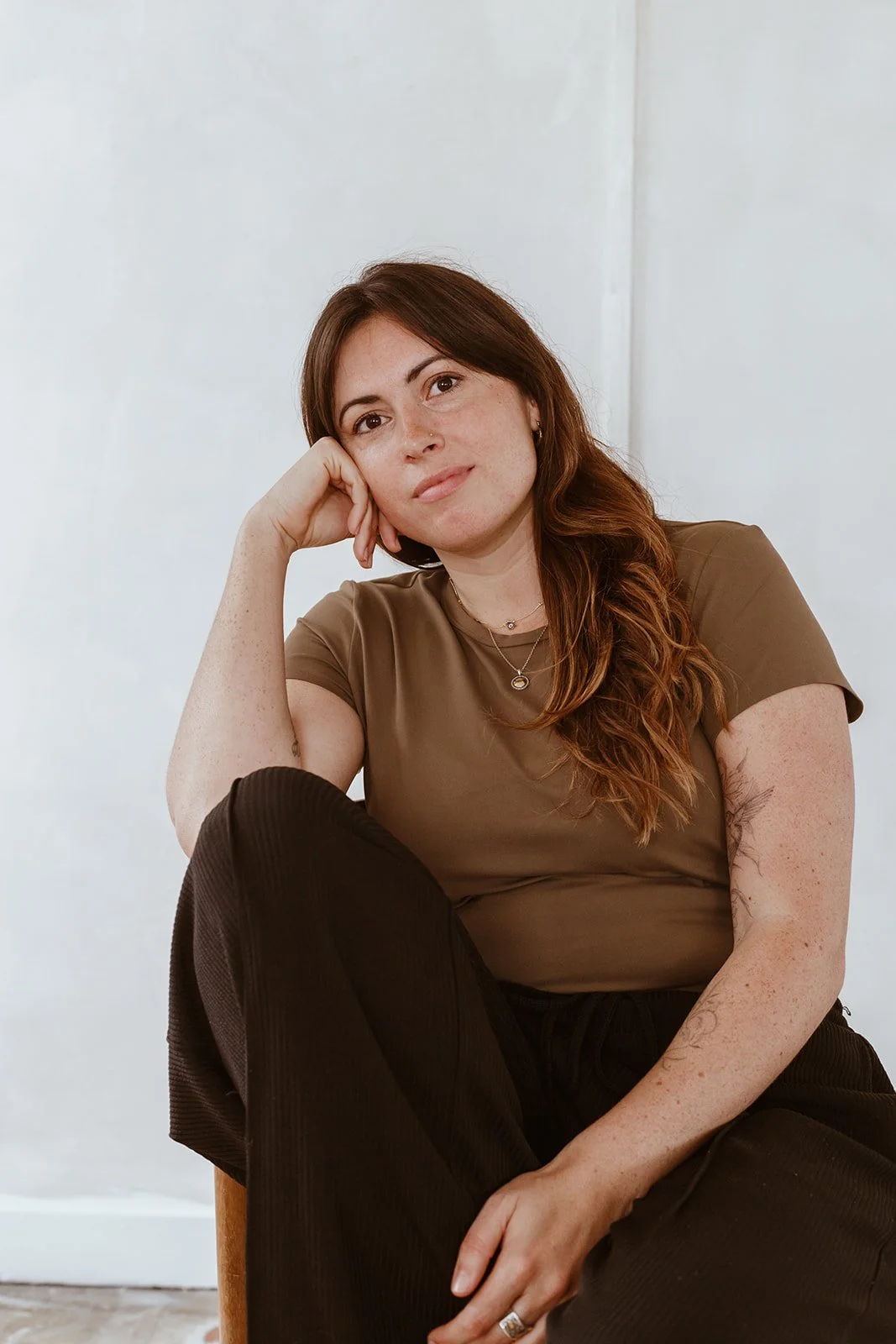 Joanna Hamilton, somatic hypnotherapist in Bristol, sitting calmly in a natural light setting
