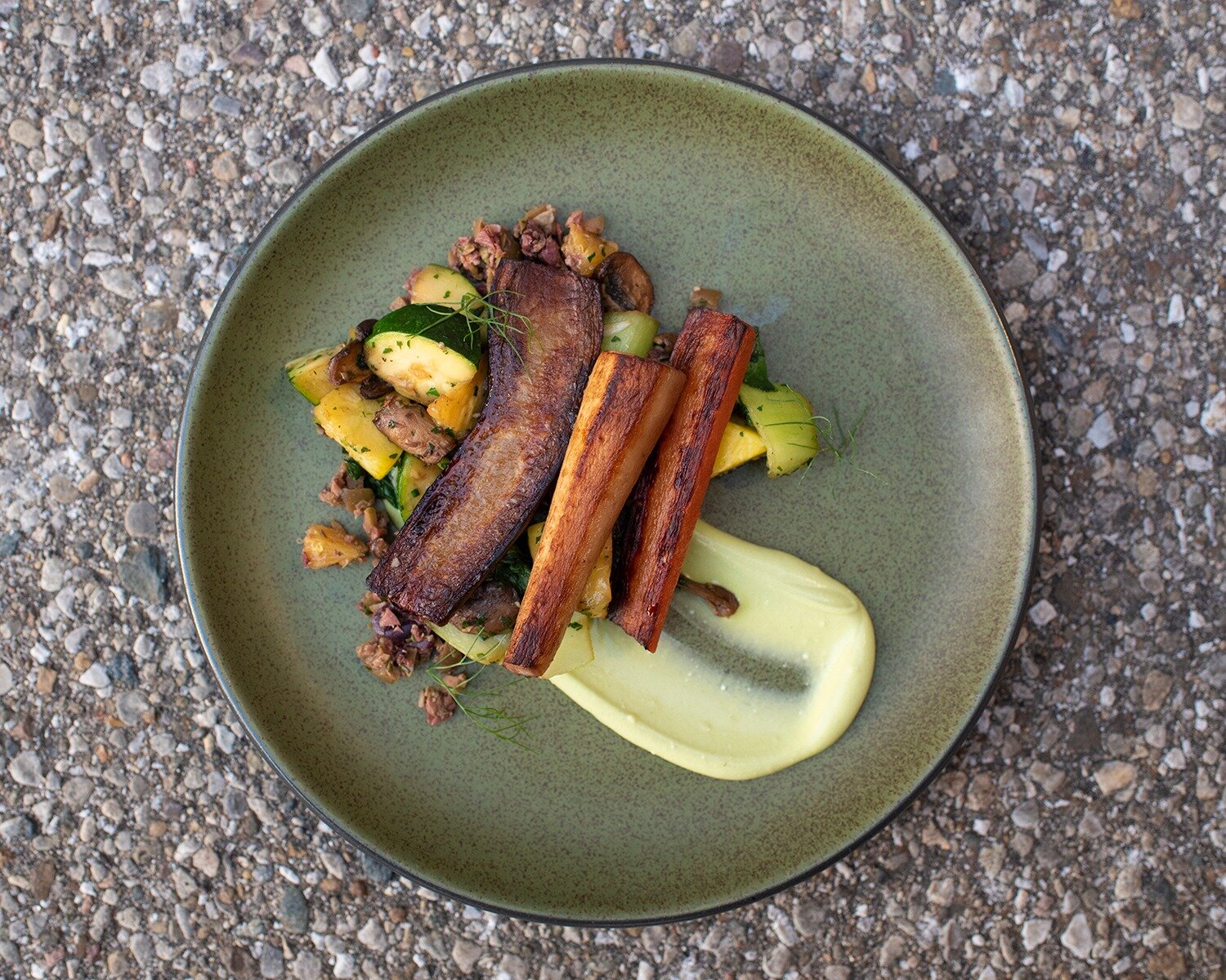 Savor the exquisite blend of flavors in our Braised Carrots dish&mdash;each carrot infused with tenderness, complemented by the crisp freshness of bok choy, the earthy richness of mushrooms, and the subtle sweetness of squash. Crowned with a parsley 