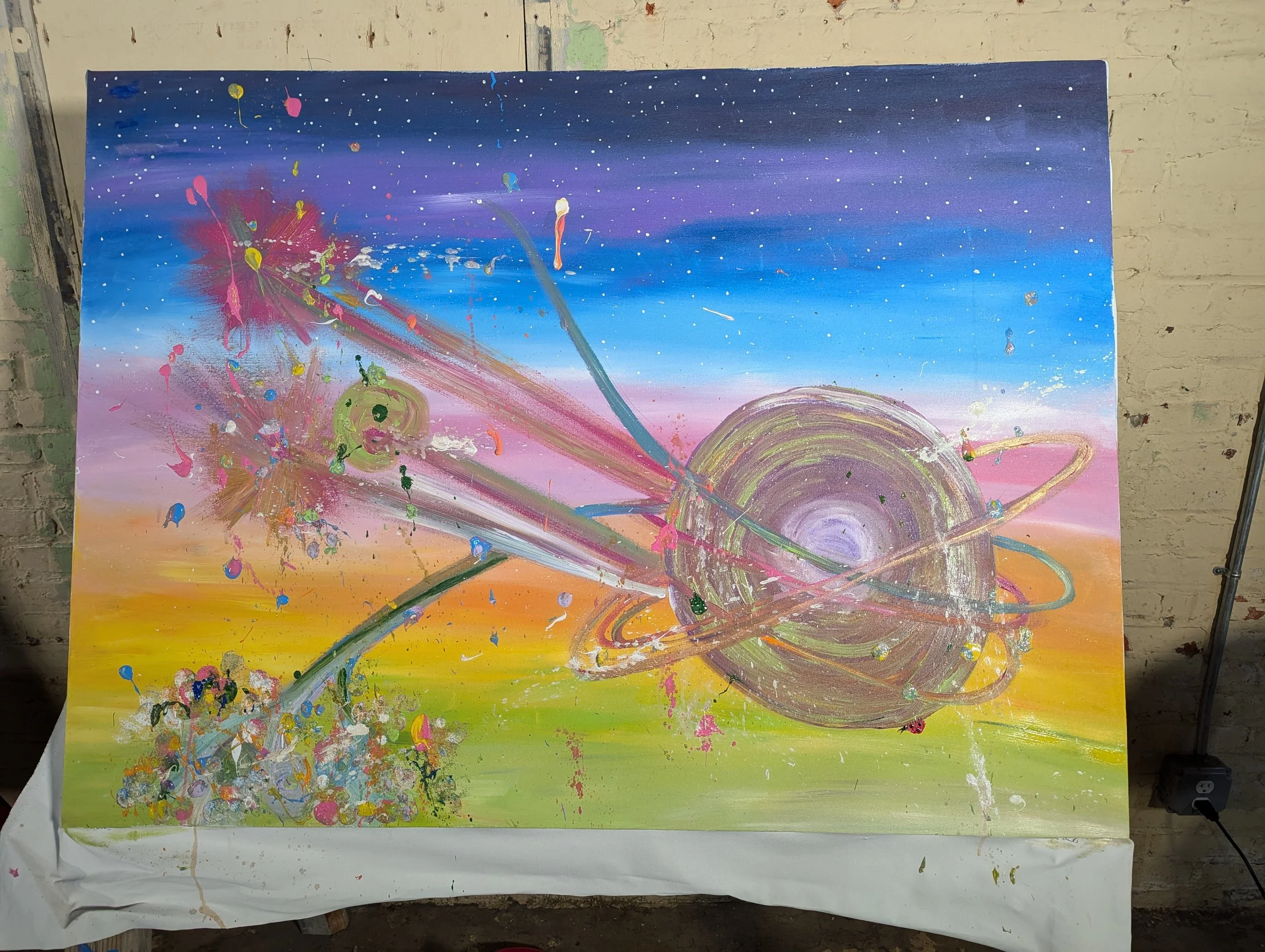 planetary body exploding with sparks and possibilities on a rainbow background