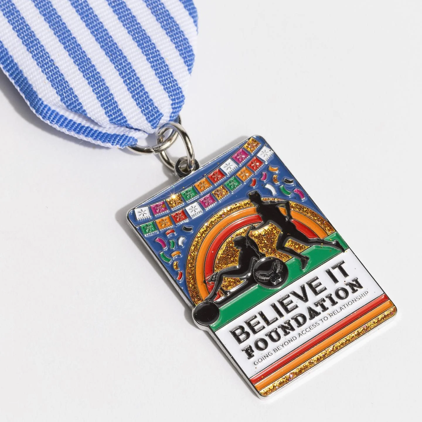 Believe It Foundation Fiesta Medal by Core Creative