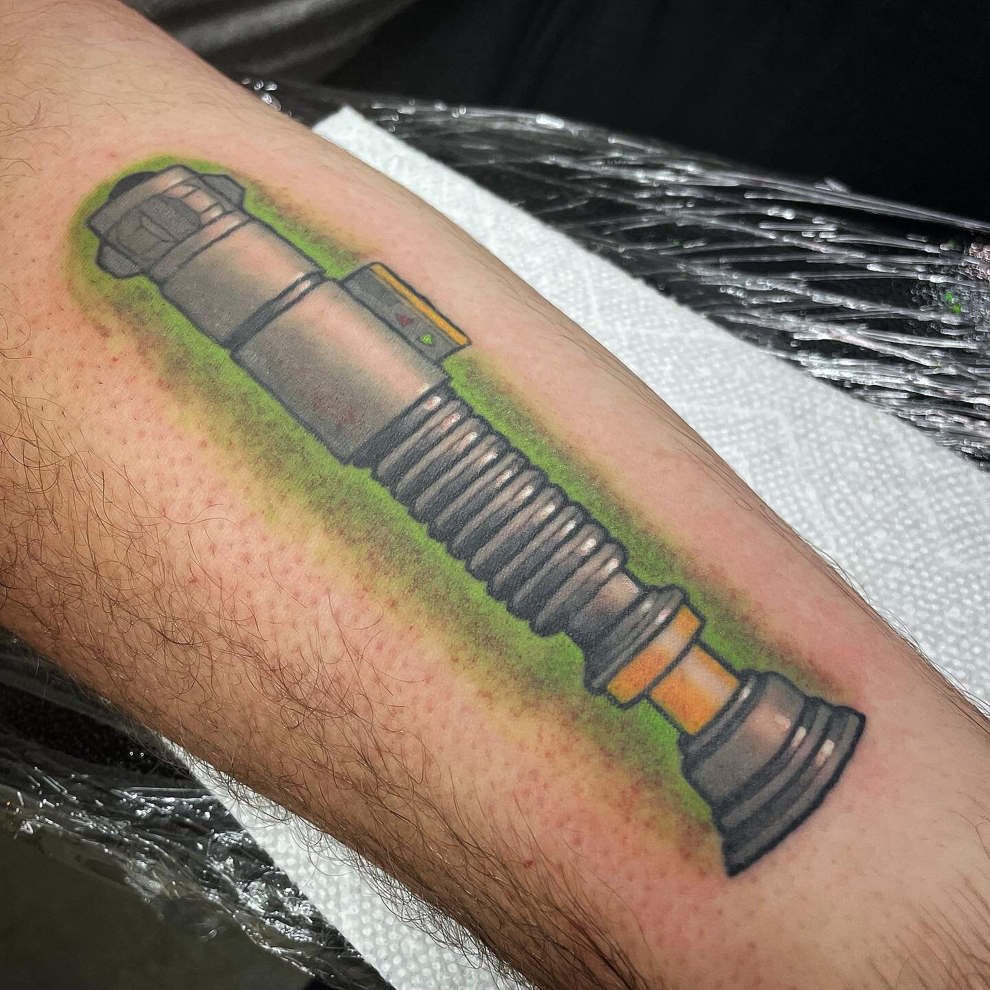 Star Wars lightsaber done by @codysmithtattoos at our kennesaw location. Stop by and chat with him to make an appointment! #tattoo #tattoos #starwars #ink #lightsaber