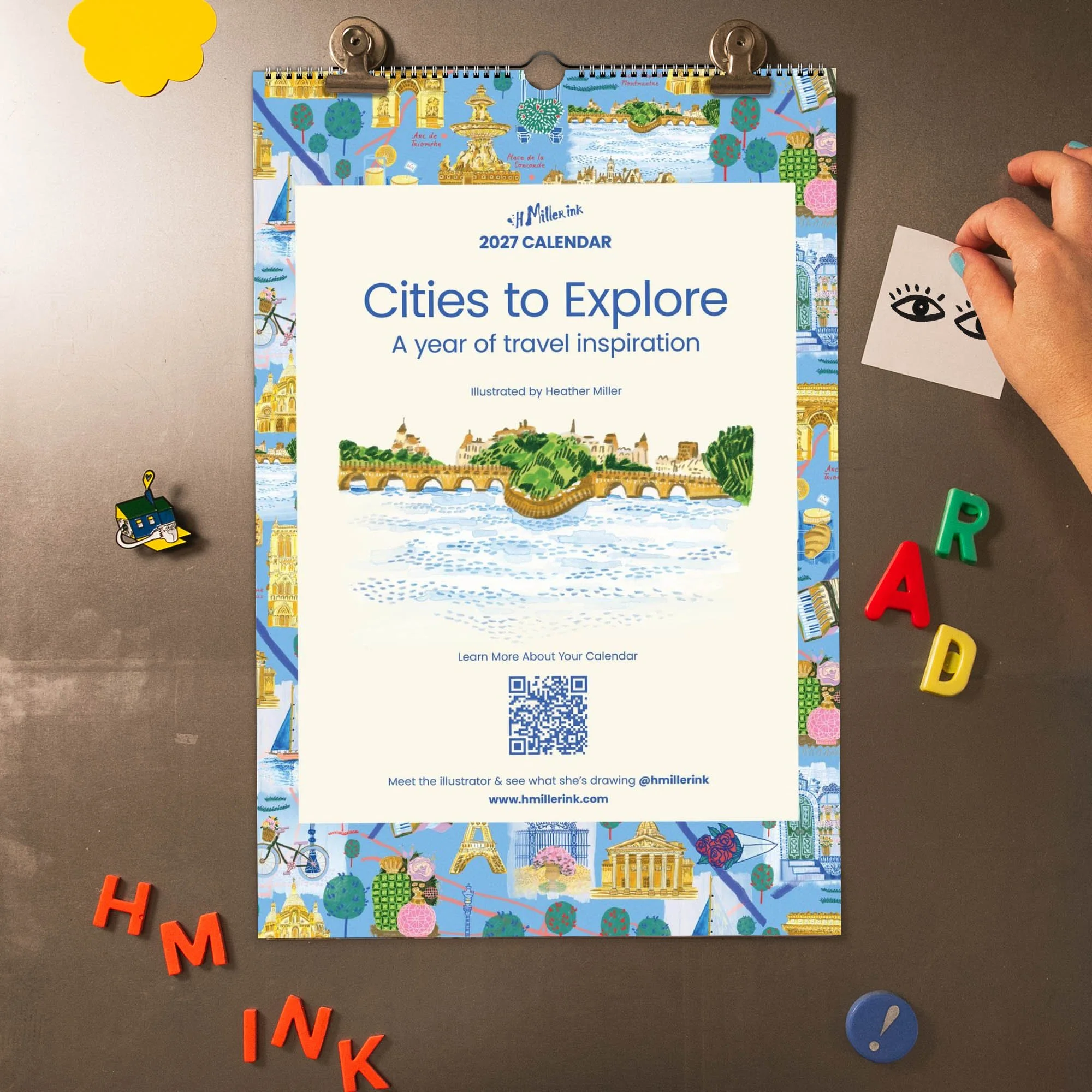 2027 Travel Wall Calendar with hand-drawn illustrations by illustrator Heather Miller. 12 cities, doubles as frameable art prints.