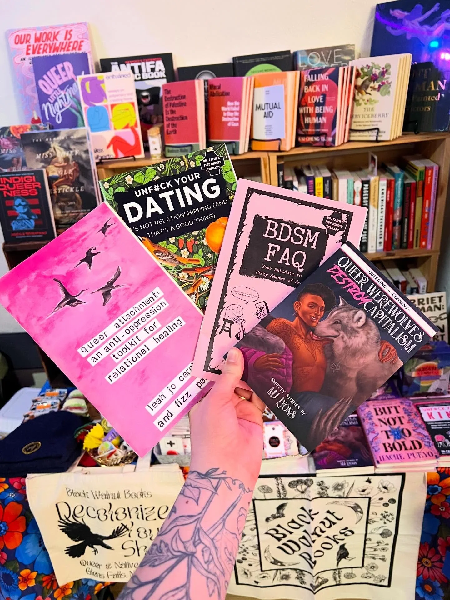 All set up at the @abiggaymarket kinky market at @refugetroy with a restock of some of my favorite @microcosm_pub titles! Here with some amazing vendors and full schedule of performers from 6-10pm. 🌈📚