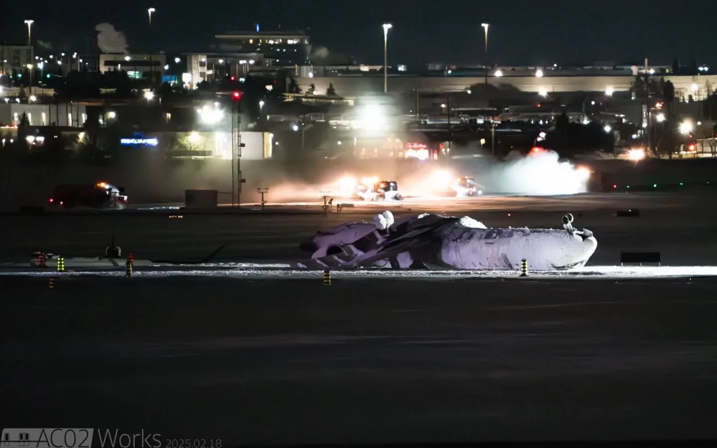 「The wreckage」

Here's the wreckage of Delta Connection flight 4819, a Bombardier CRJ-900ER sitting quietly on a chilly night, covered in firefighting foam, near the end of RWY23 at Toronto Pearson International Airport. The plane tipped over during 