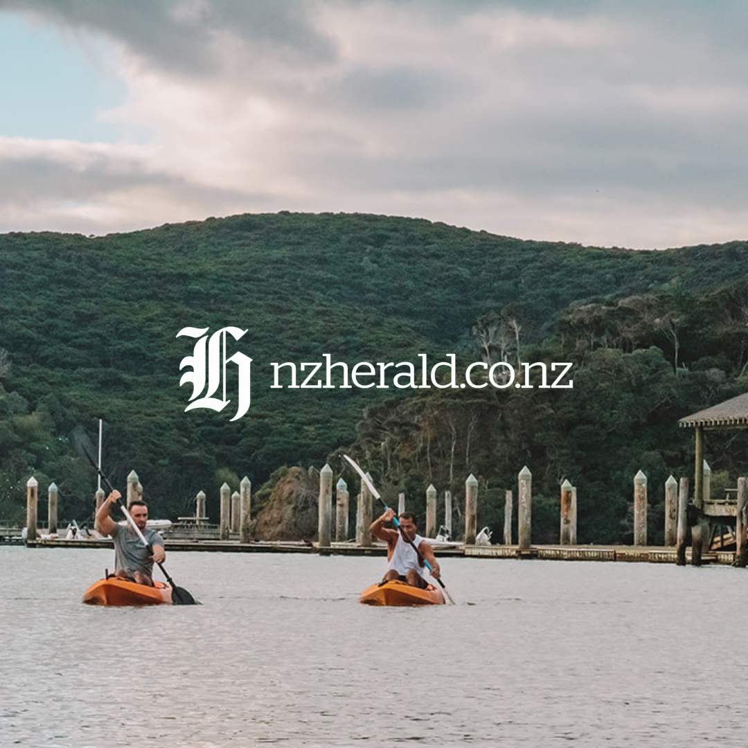 Two Men Kayaking by the Wharf
