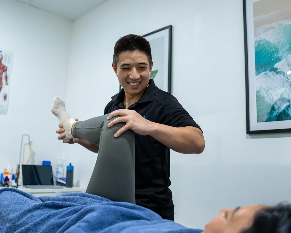 Assessing a patient's hip and knee movement during an appointment