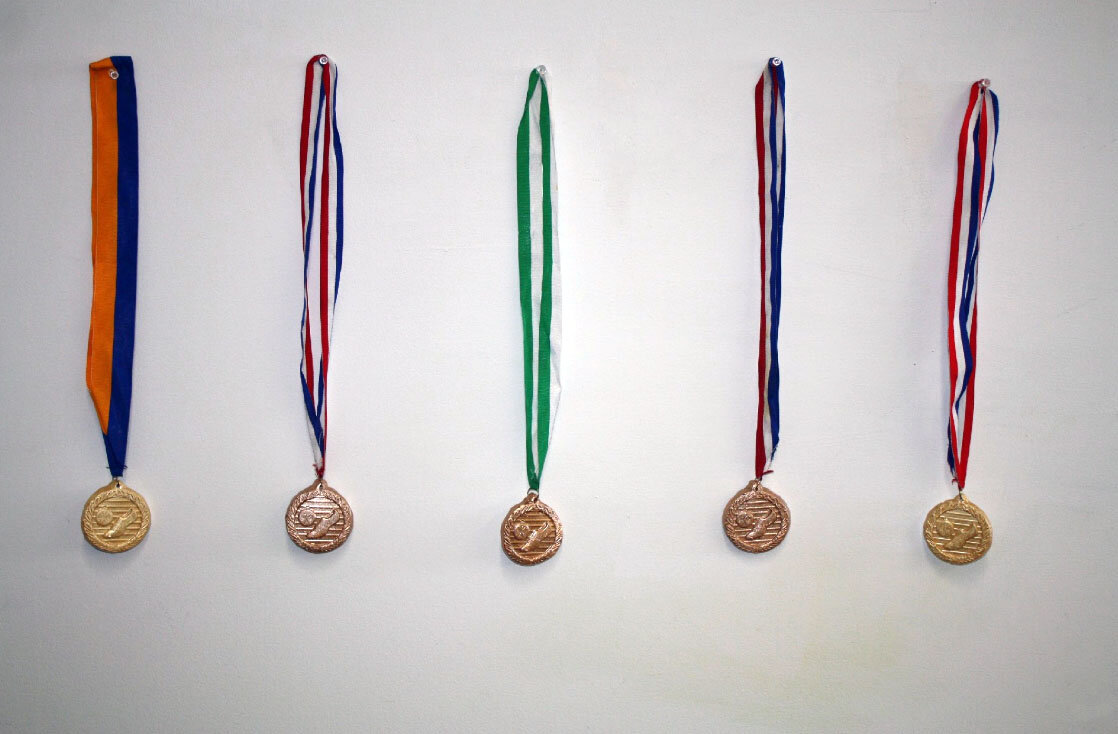 Shinny Things,
Slip cast soccer medals painted with nail polish