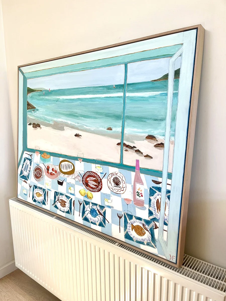 Painting of a beach view seen from inside a room, with a table setting including plates, glasses, and food, along with a pink bottle, all depicted in a colorful and stylized manner.