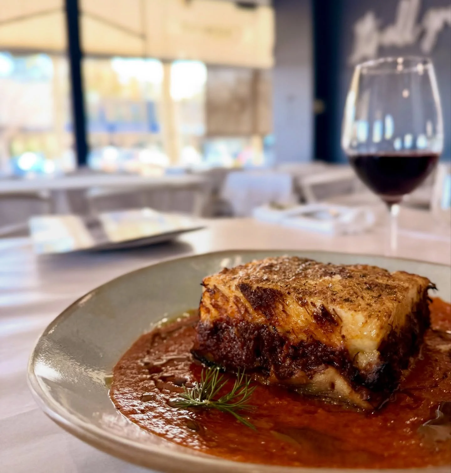 Goat Moussaka! 🍆 
Goat ragu, potato, eggplant, topped with creamy béchamel. 
So good. 
Pair with a Greek Xinomavro or Agiorgitiko wine. 🍷 This week only at OPA
🇬🇷