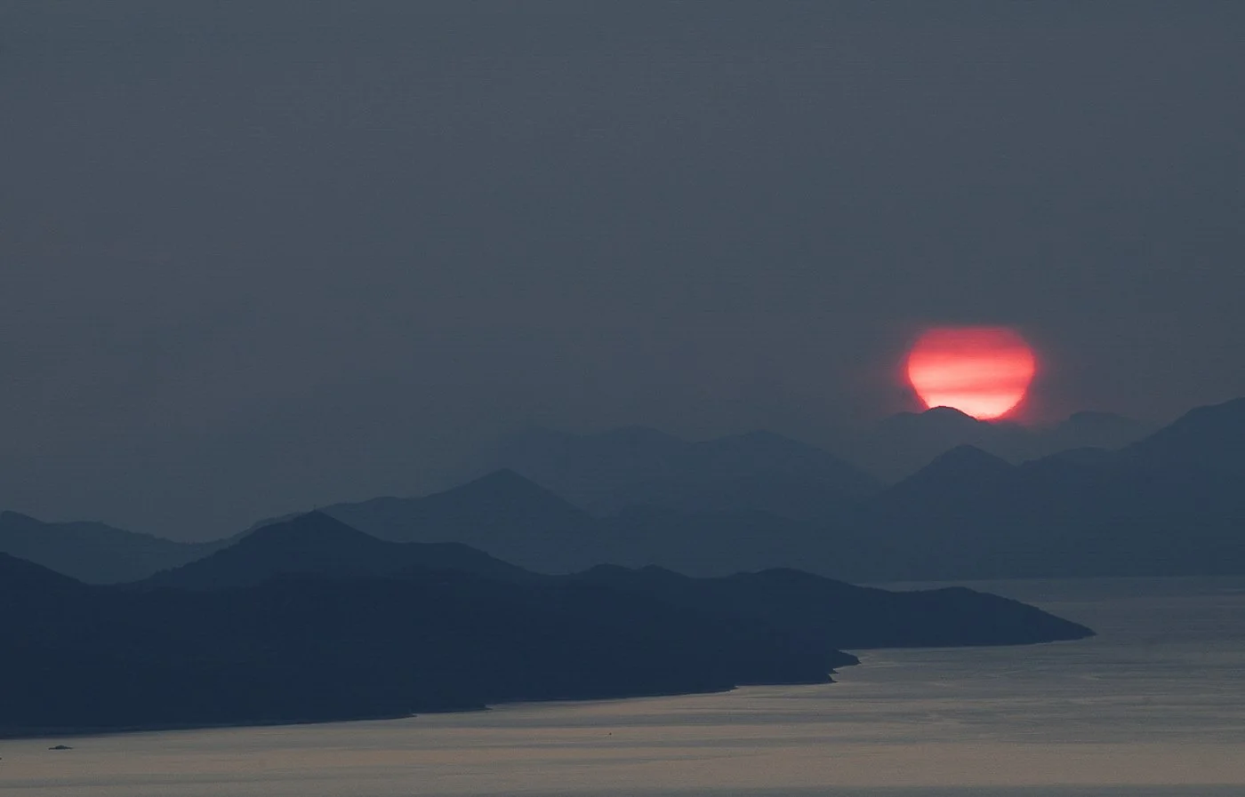 SUN SLIPS INTO THE SLEEPING PLACE