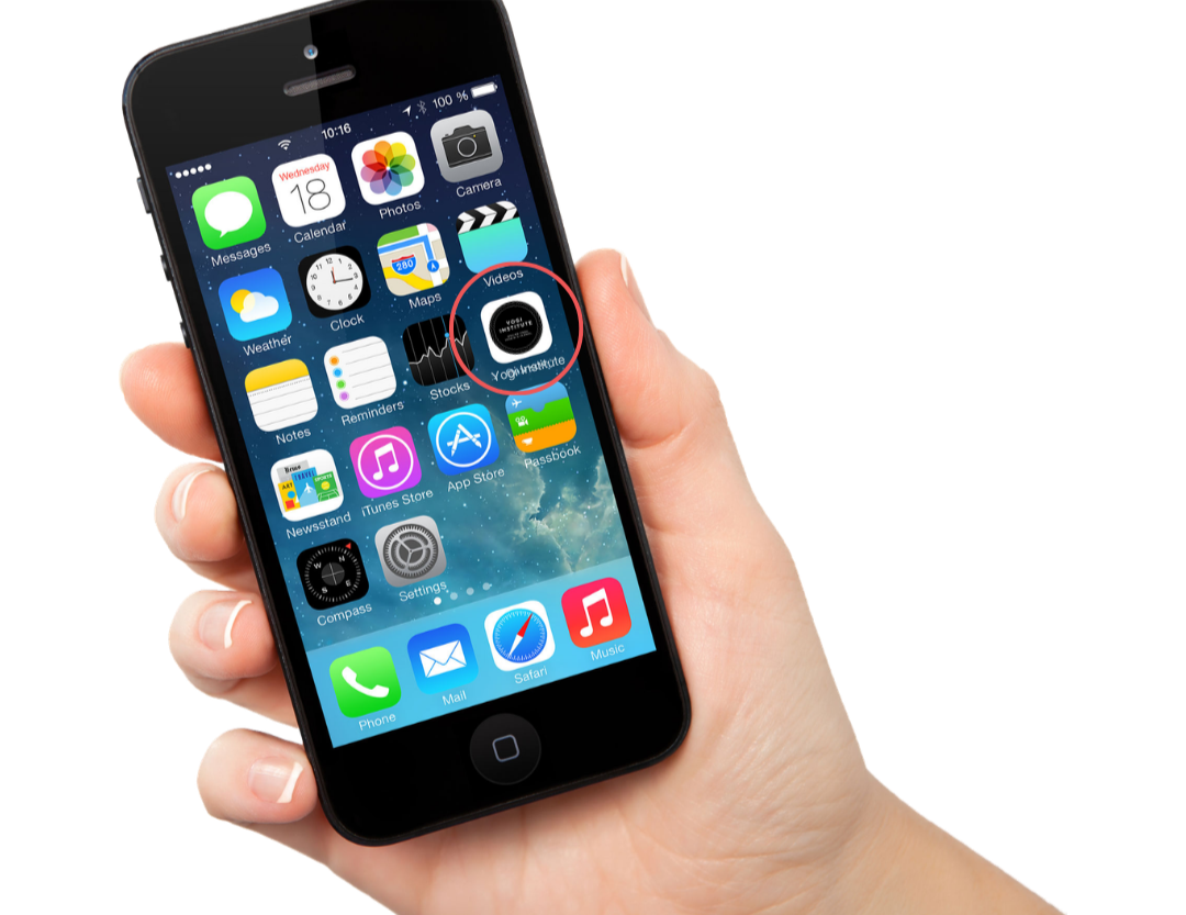 Hand holding a black iPhone with several app icons on the screen, including Messages, Calendar, Photos, Camera, Weather, Clock, Maps, Videos, Notes, Reminders, Stocks, Passbook, iTunes Store, App Store, Settings, Phone, Mail, Safari, and Music.