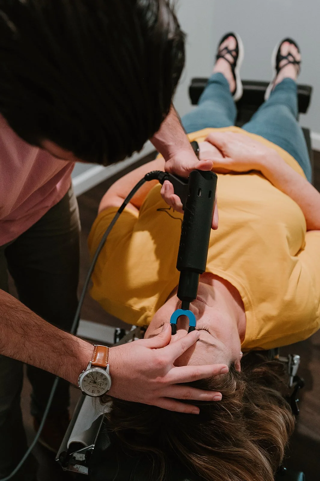 Instrument-assisted chiropractic adjustment to relieve headache and neck tension at MCH Chiropractic & Nutrition in Matthews, NC