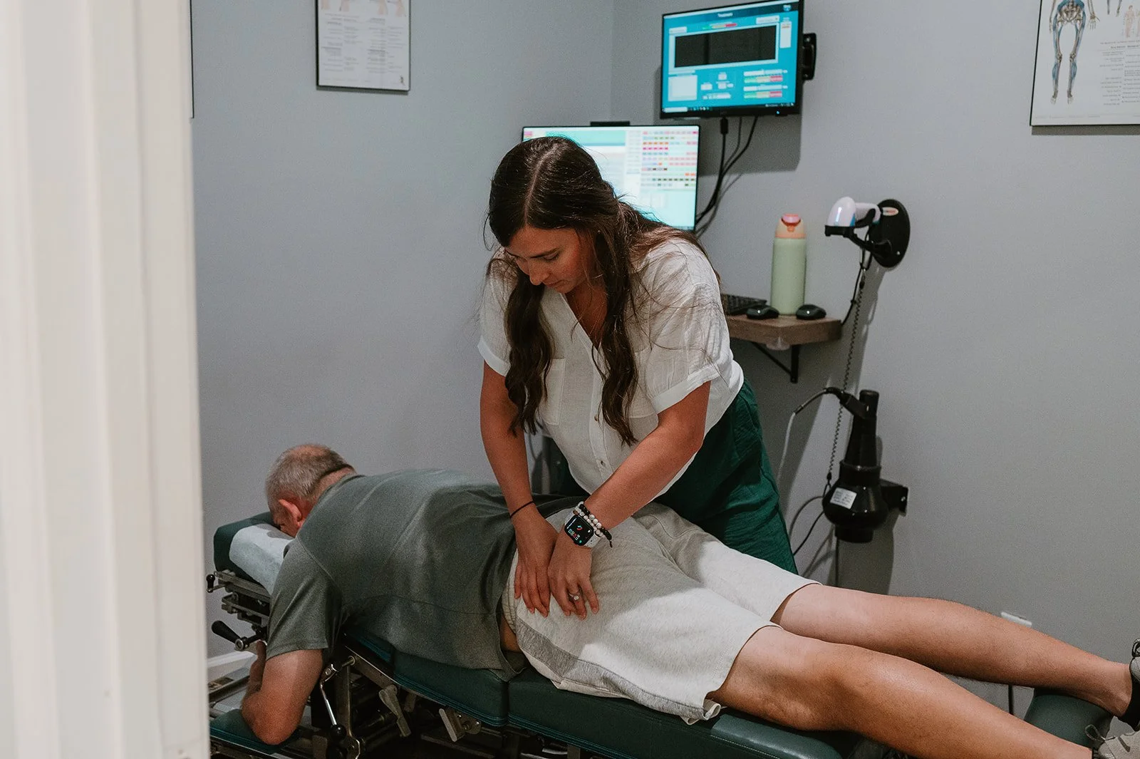 Chiropractor performing a gentle low back adjustment to relieve back pain at MCH Chiropractic & Nutrition in Matthews, NC