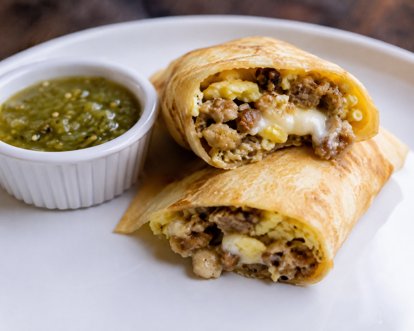 Sausage, egg, and provolone crepes with salsa verde.png