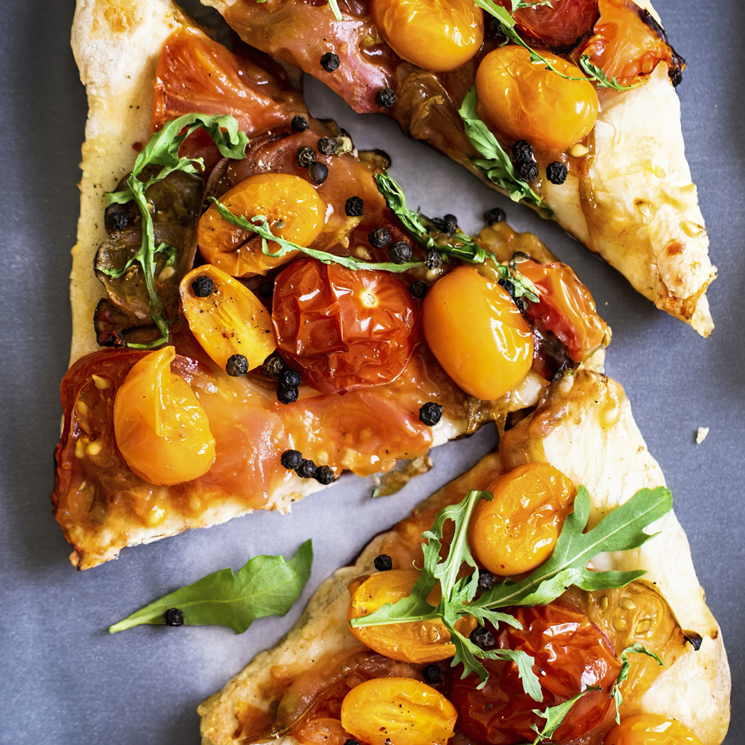 Mediterranean flatbread with roasted vegetables, capers and arugula
