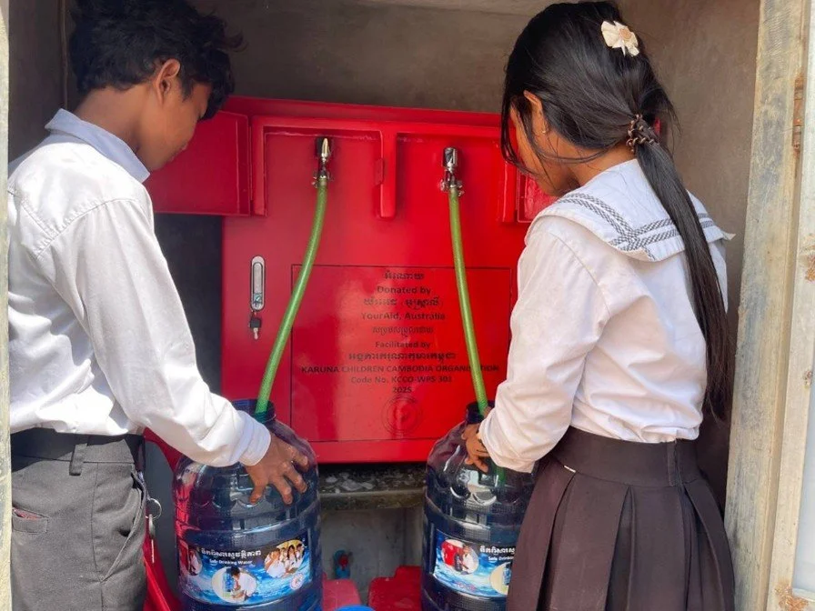 Students filling dispensers from WPS