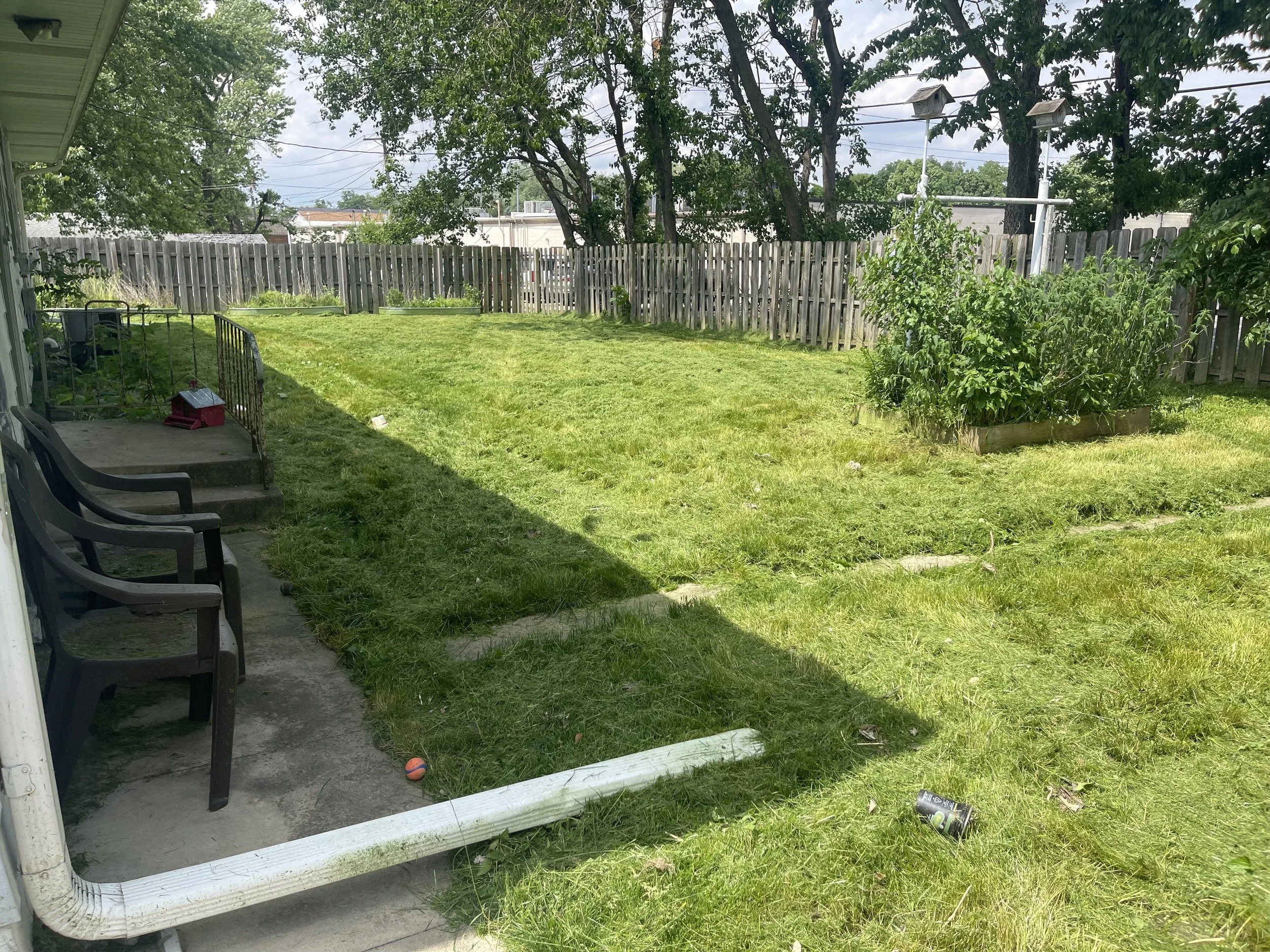 The same Bourbonnais backyard after mowing the overgrown grass.