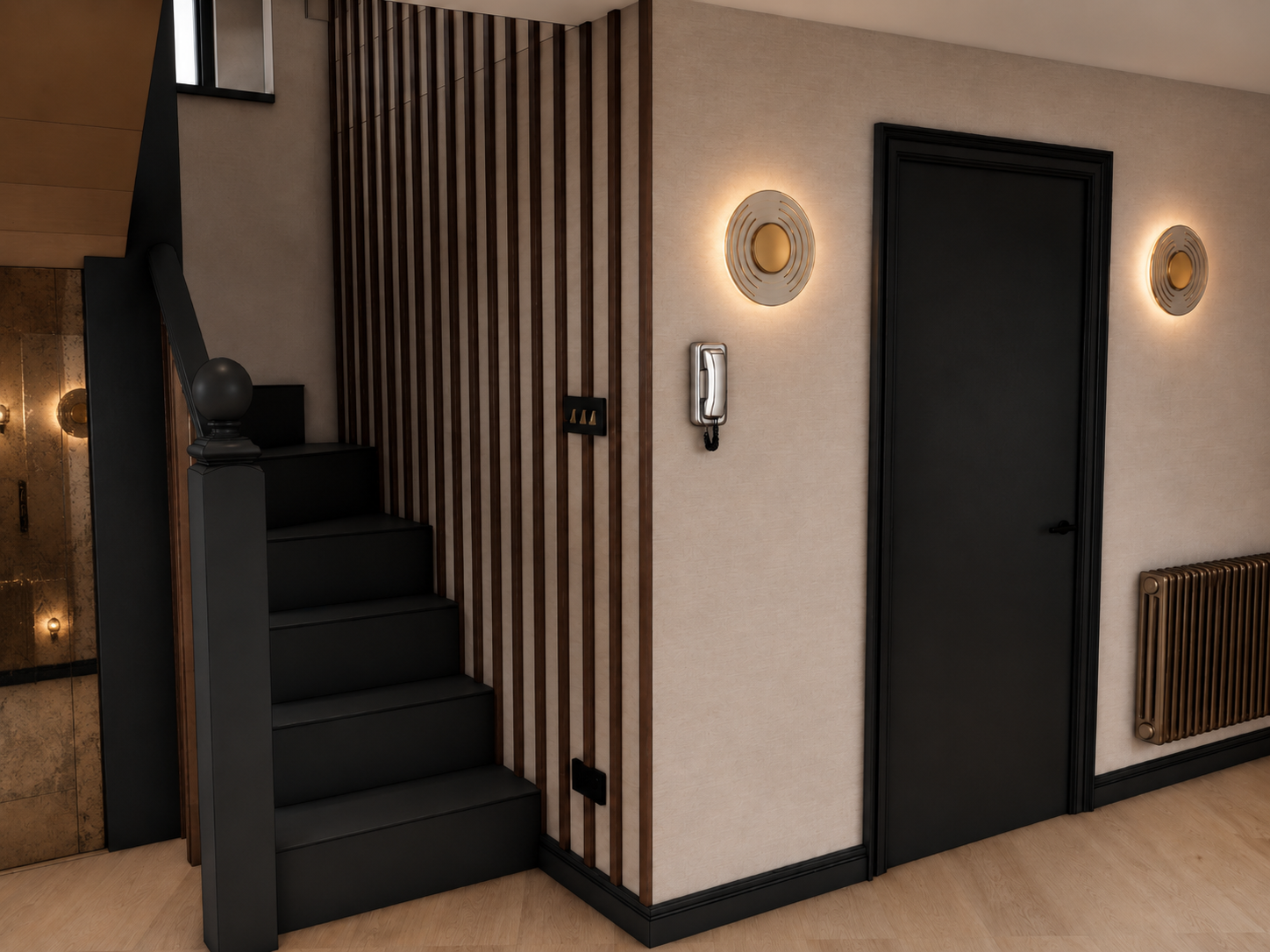 Design visual of hallway and staircase at Clements Wharf Durham, featuring dark painted stair treads with a black newel post, walnut slatted wall panelling, circular brass wall sconces on a textured neutral wall, black-framed door with brass handle, 