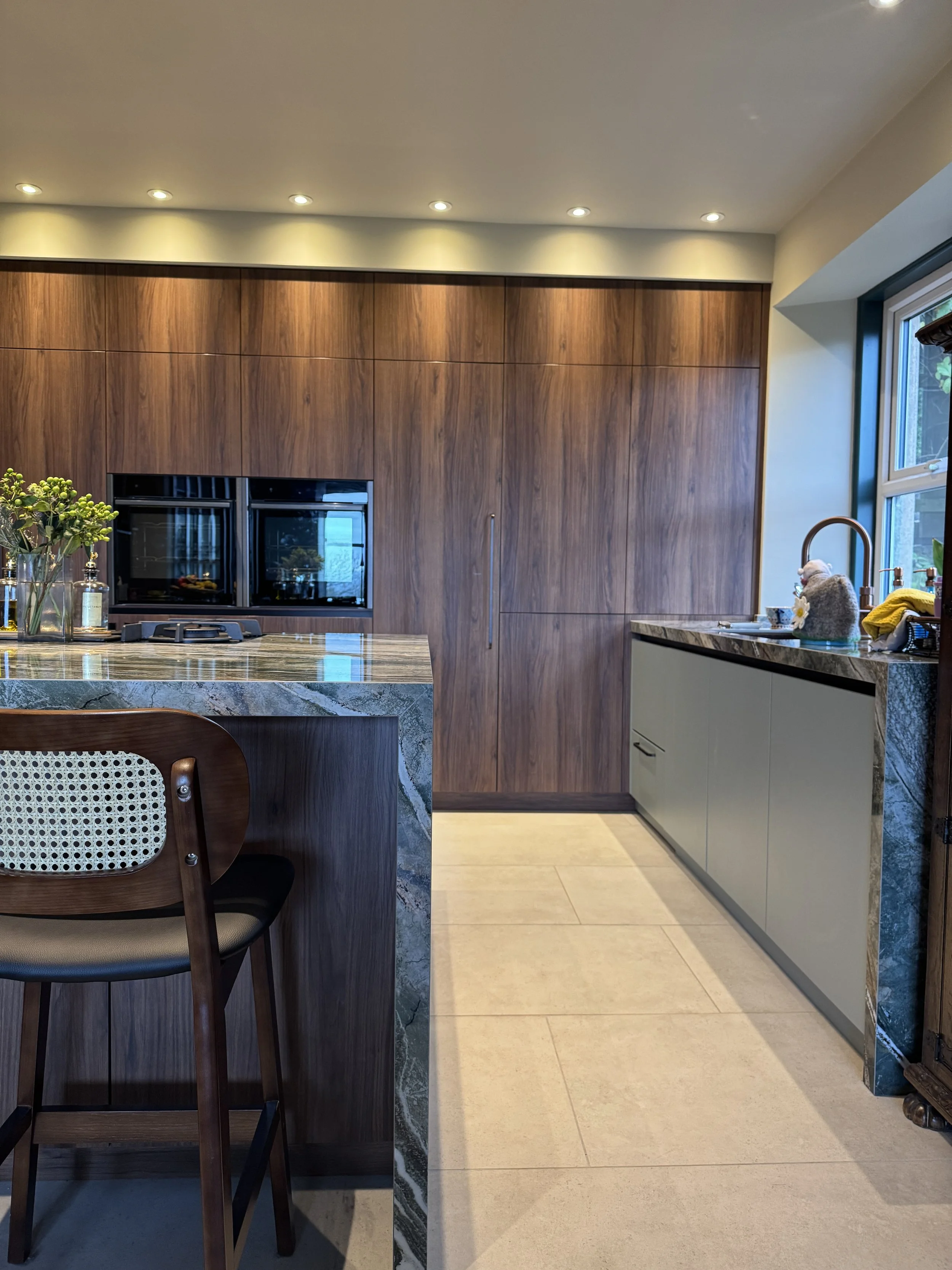 county-durham-kitchen-walnut-cabinetry-and-island-impactful-feature-porcelain-worktop.JPG