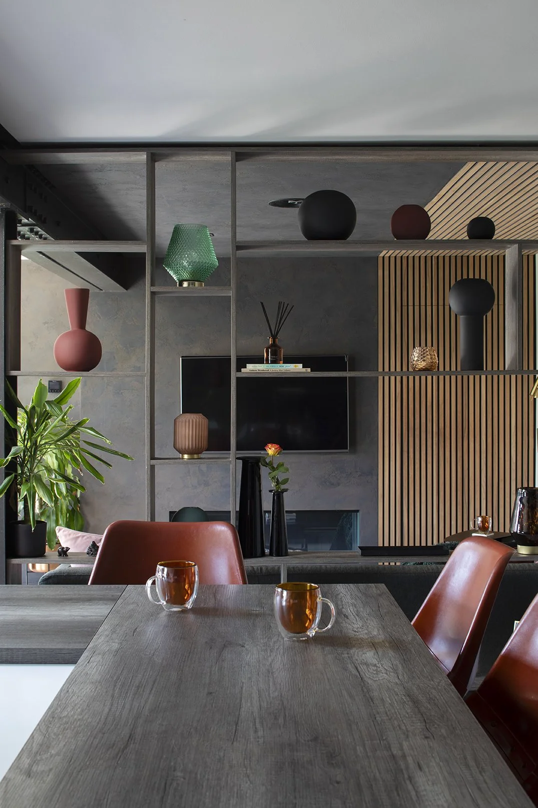 View from kitchen island bar across bespoke open shelving divider with snug door closed, Lytham Road Tynemouth interior design