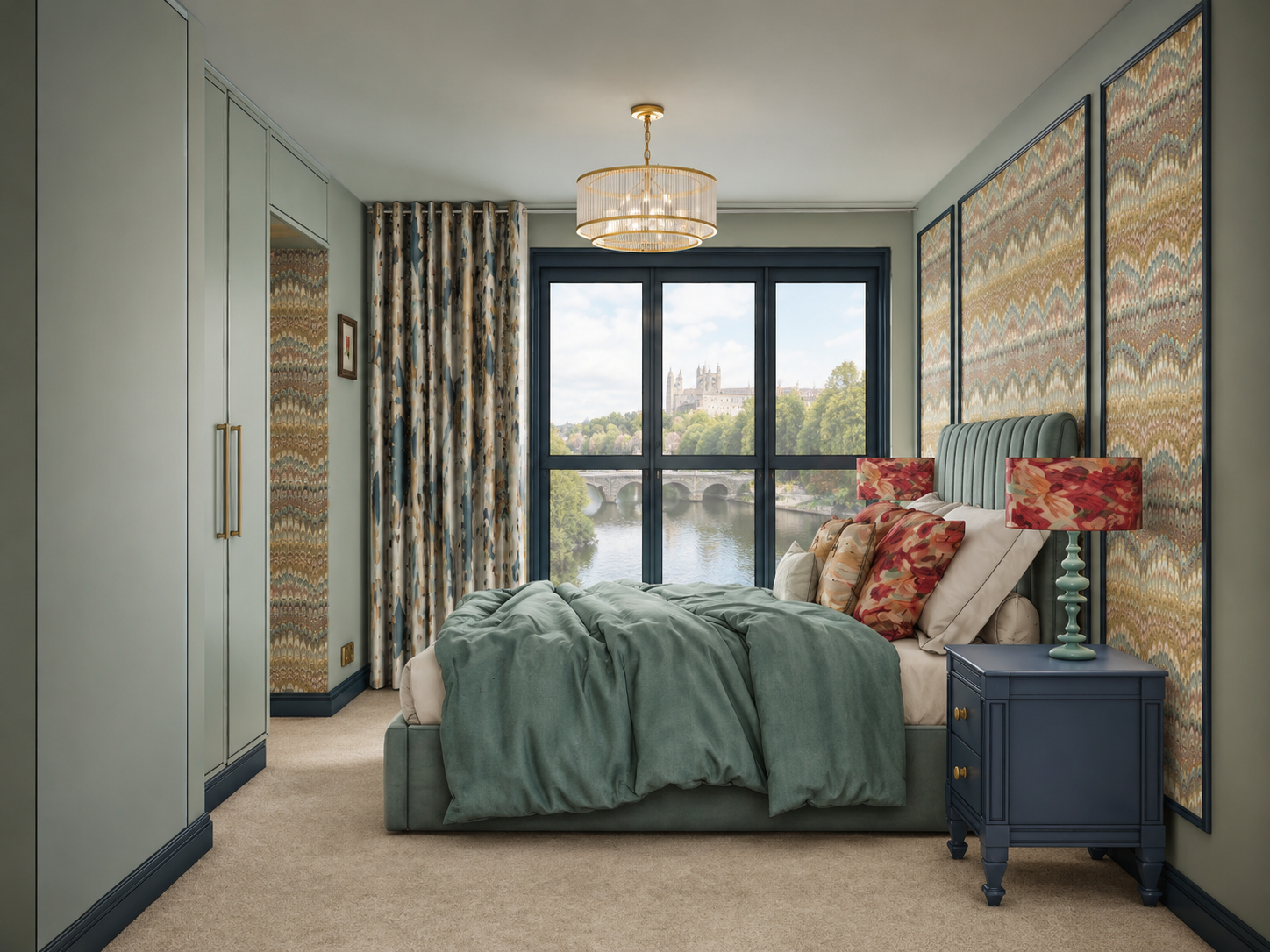 Interior design visual of the guest bedroom at Clements Wharf, Durham, by Carole Crowe Interior Design, showing a sage green upholstered channelled headboard with teal velvet bedding and bold floral scatter cushions, navy blue bedside tables with flo