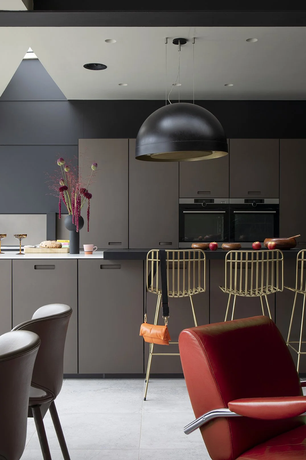 whitley-bay-kitchen-black-cabinetry-brass-bar-stools.jpg