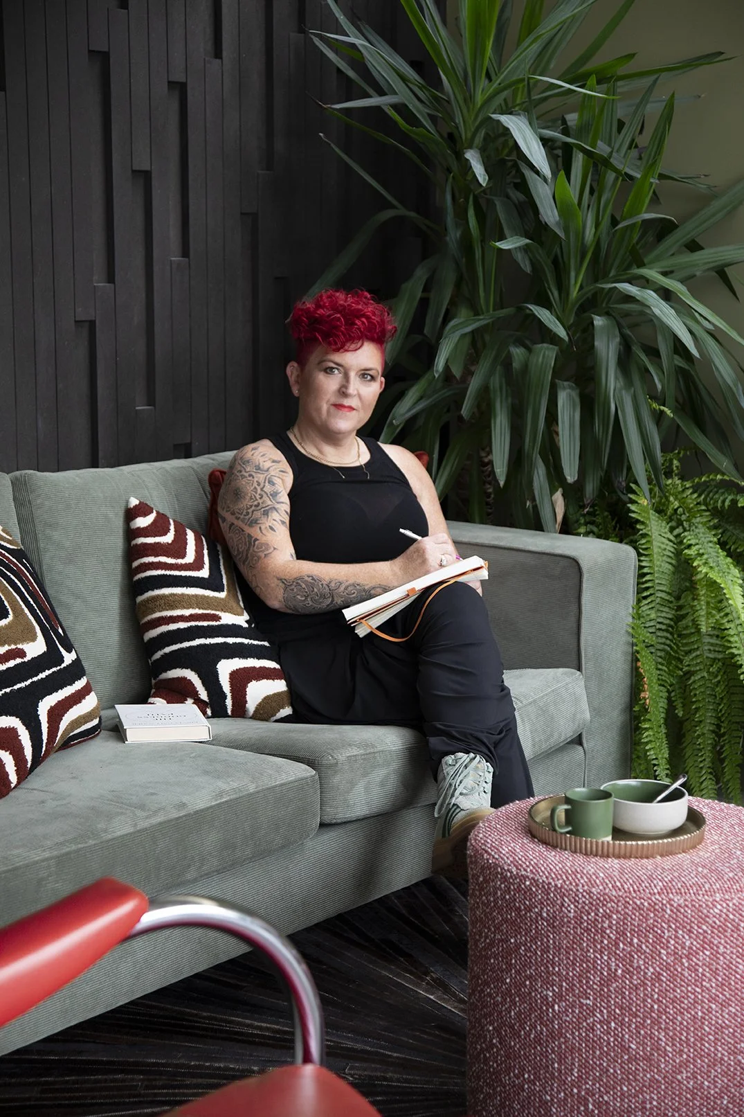 Carole Crowe, author and interior designer, writing in a calm interior space about home, identity and emotional belonging.
