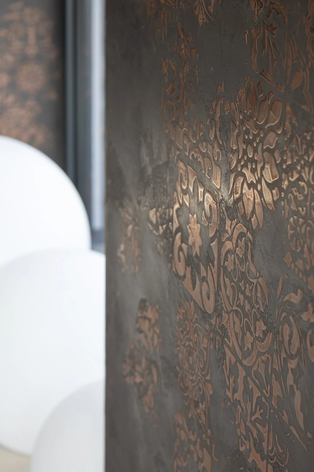 Extreme close-up of handcrafted black and copper Venetian plaster wall texture, kitchen feature wall, Lytham Road Tynemouth