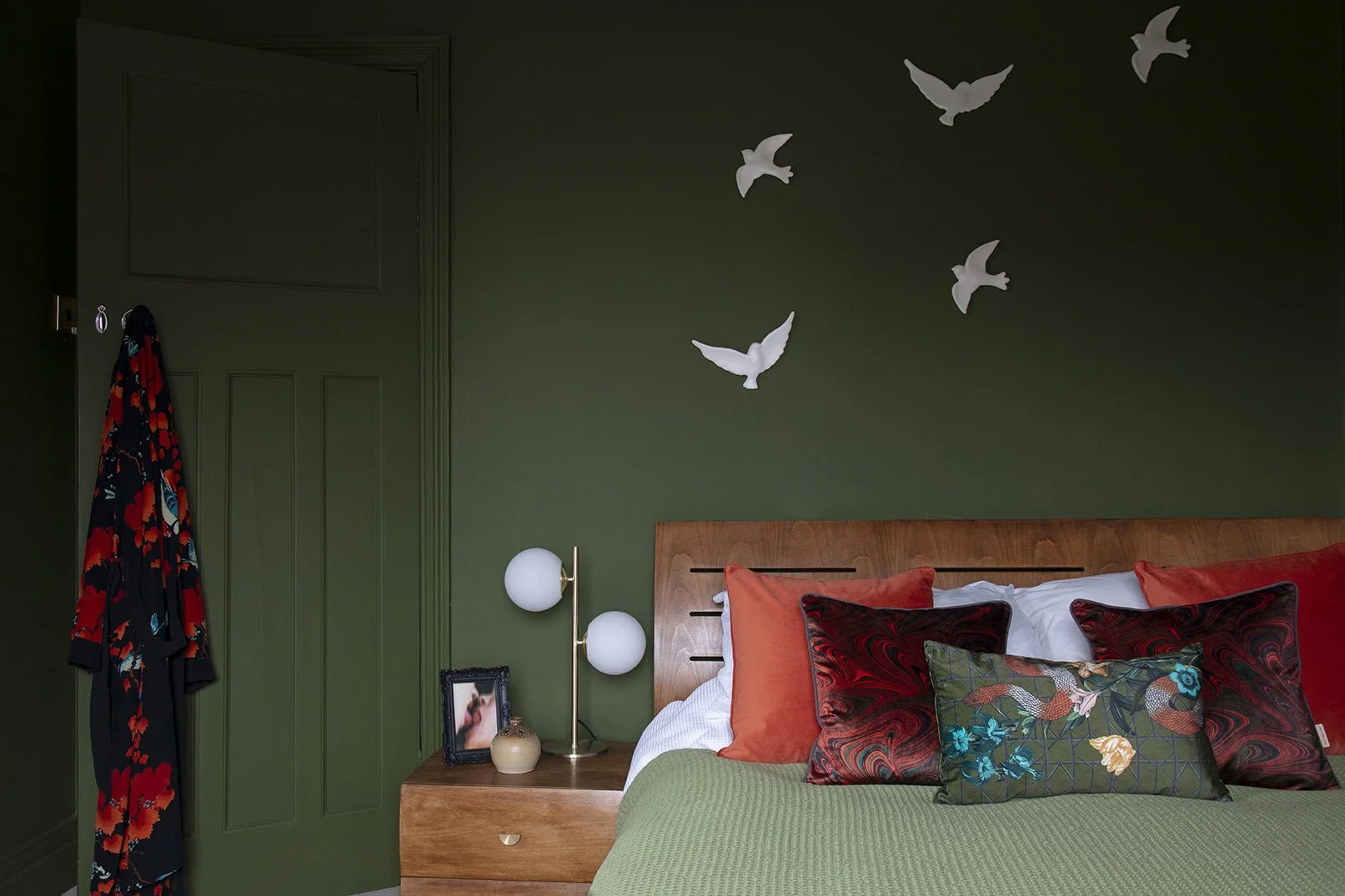 1-whitley-bay-olive-green-bedroom-feature-artwork-warm-wood-bed.jpg