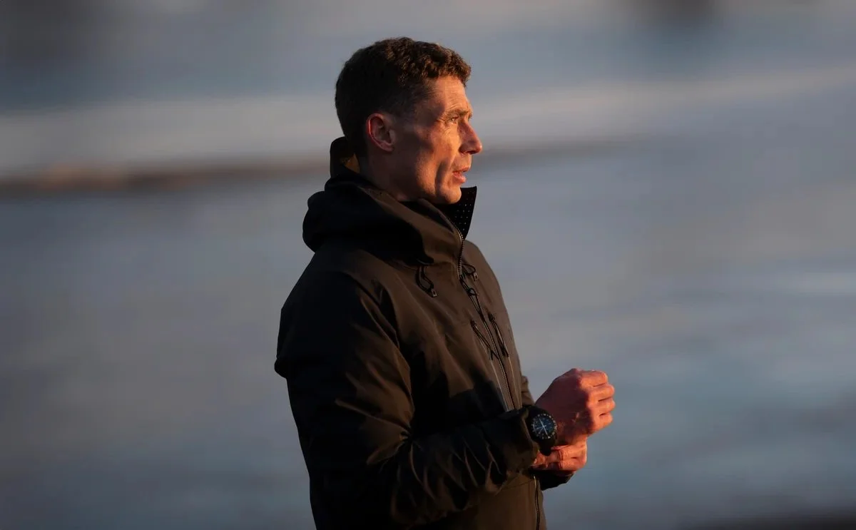 British male model Matt Sharman wears a black jacket made by Shackleton in a lifestyle shoot in South-West England