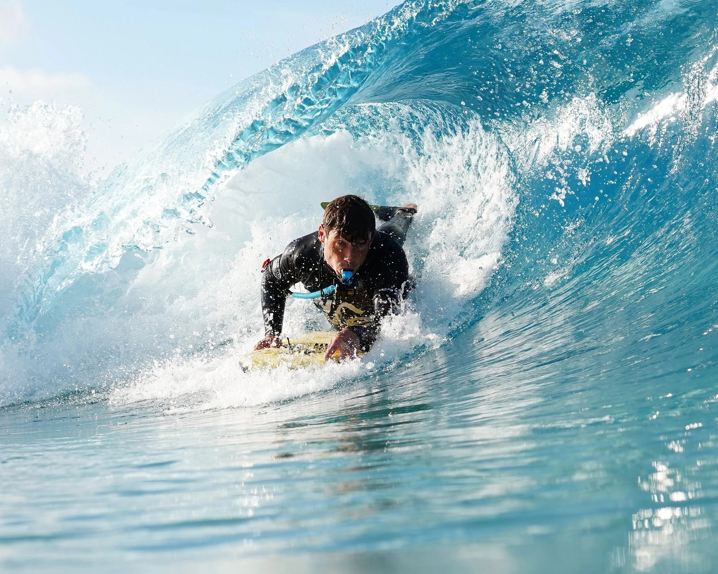 Bodyboarder Matt Sharman skilfully navigates a perfect blue barrelling wave at The Wave in Bristol 