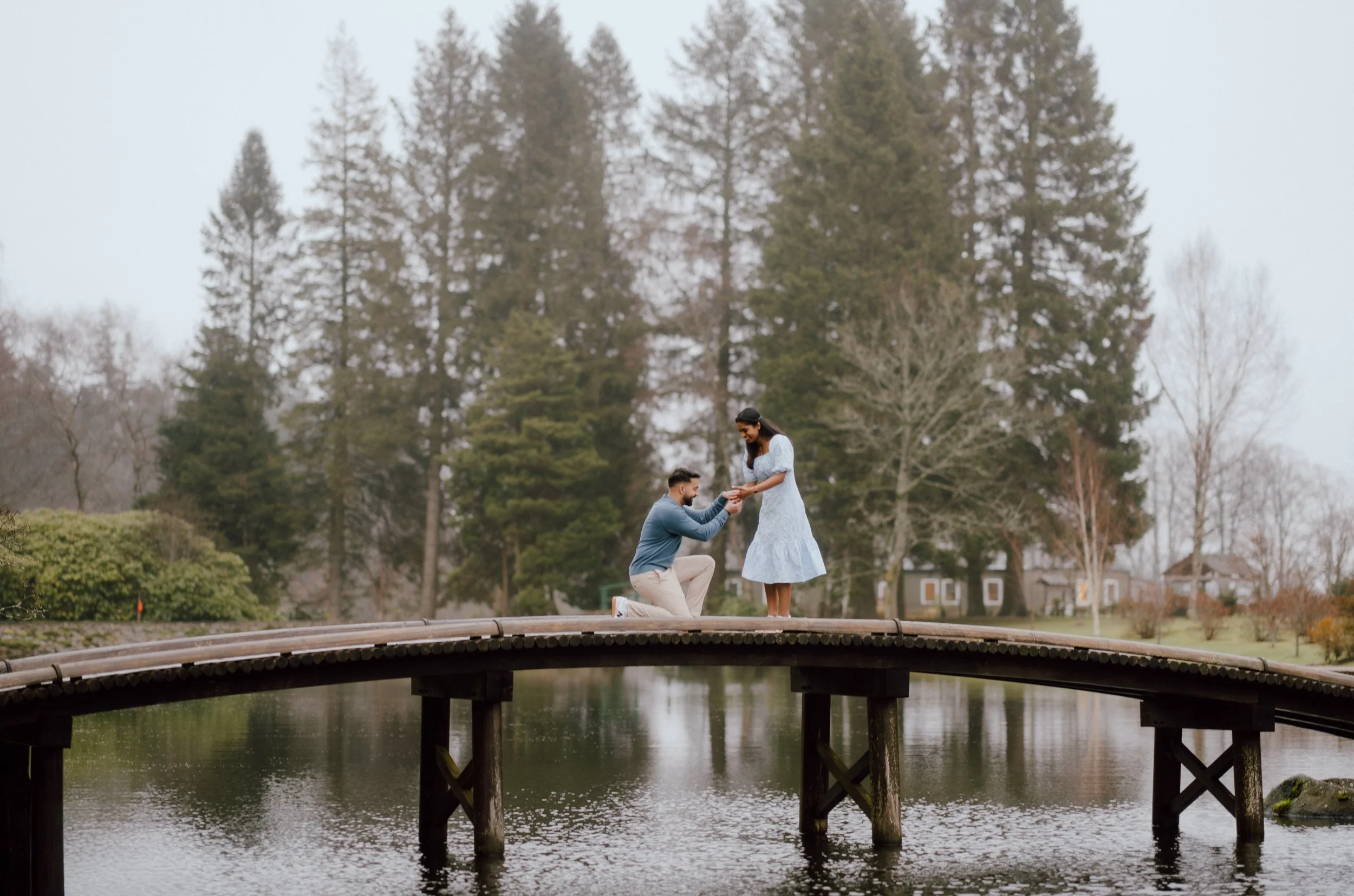  Proposal photoshoot at Cowden Japanese Garden near Dollar with couple celebrating outside the tea house captured by Patrice little photography 