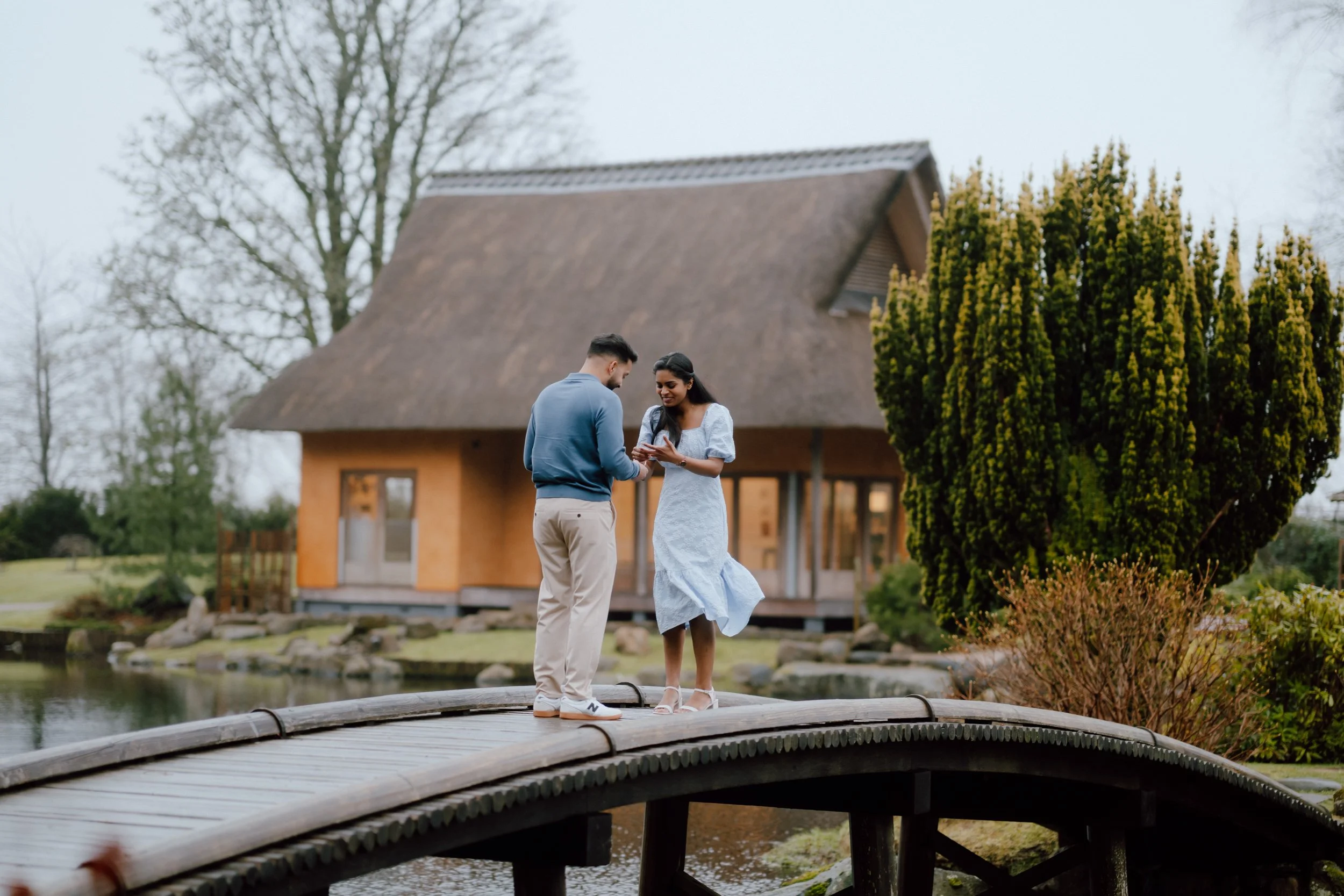  Proposal photoshoot at Cowden Japanese Garden near Dollar with couple exchanging rings captured by Patrice little photography 