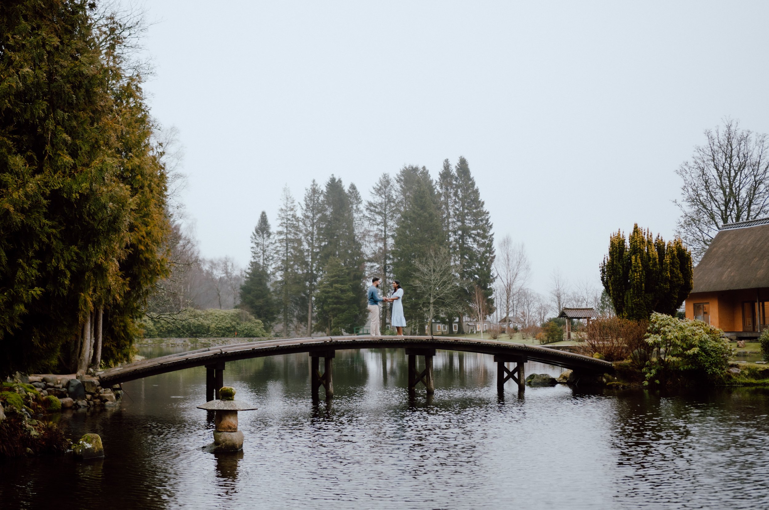   Romantic proposal on wooden bridge at Cowden Japanese Garden in Scotland captured by patrice little photography  