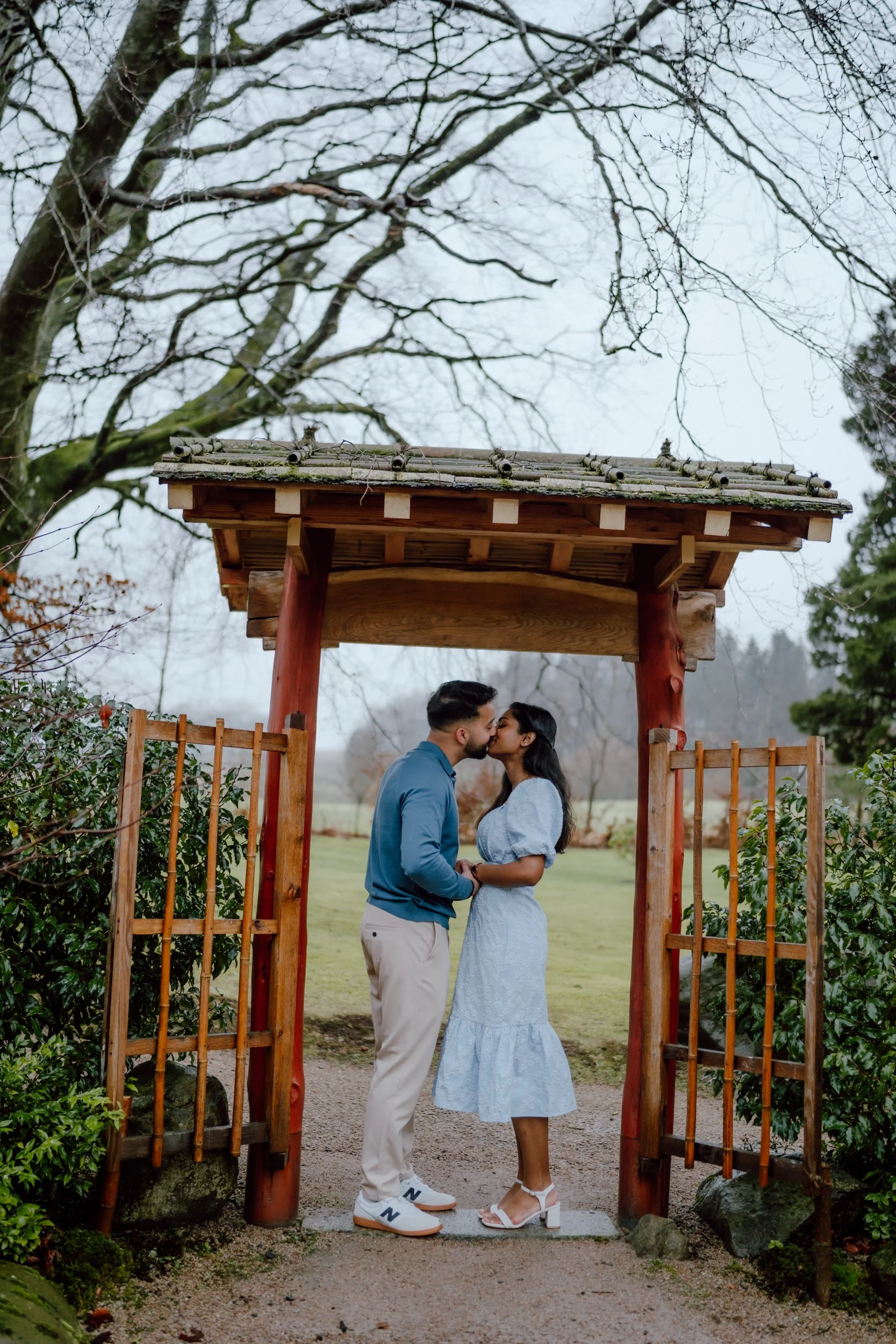  Couple portrait at Cowden Japanese Garden pavilion during proposal photoshoot near Dollar captured by patrice little photography 