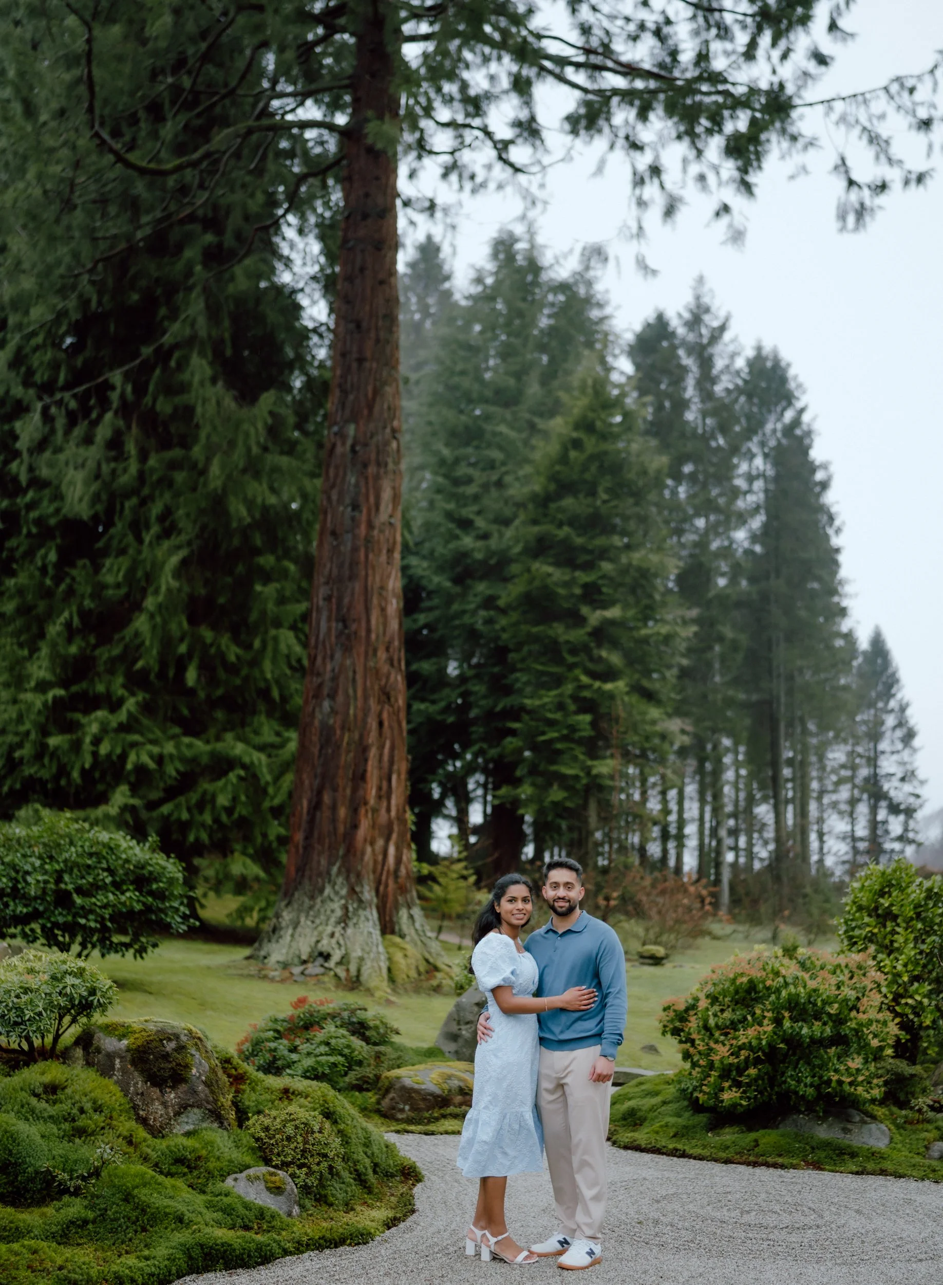  Couple portrait at Cowden Japanese Garden tall wodland trees during proposal photoshoot near Dollar captured by patrice little photography 