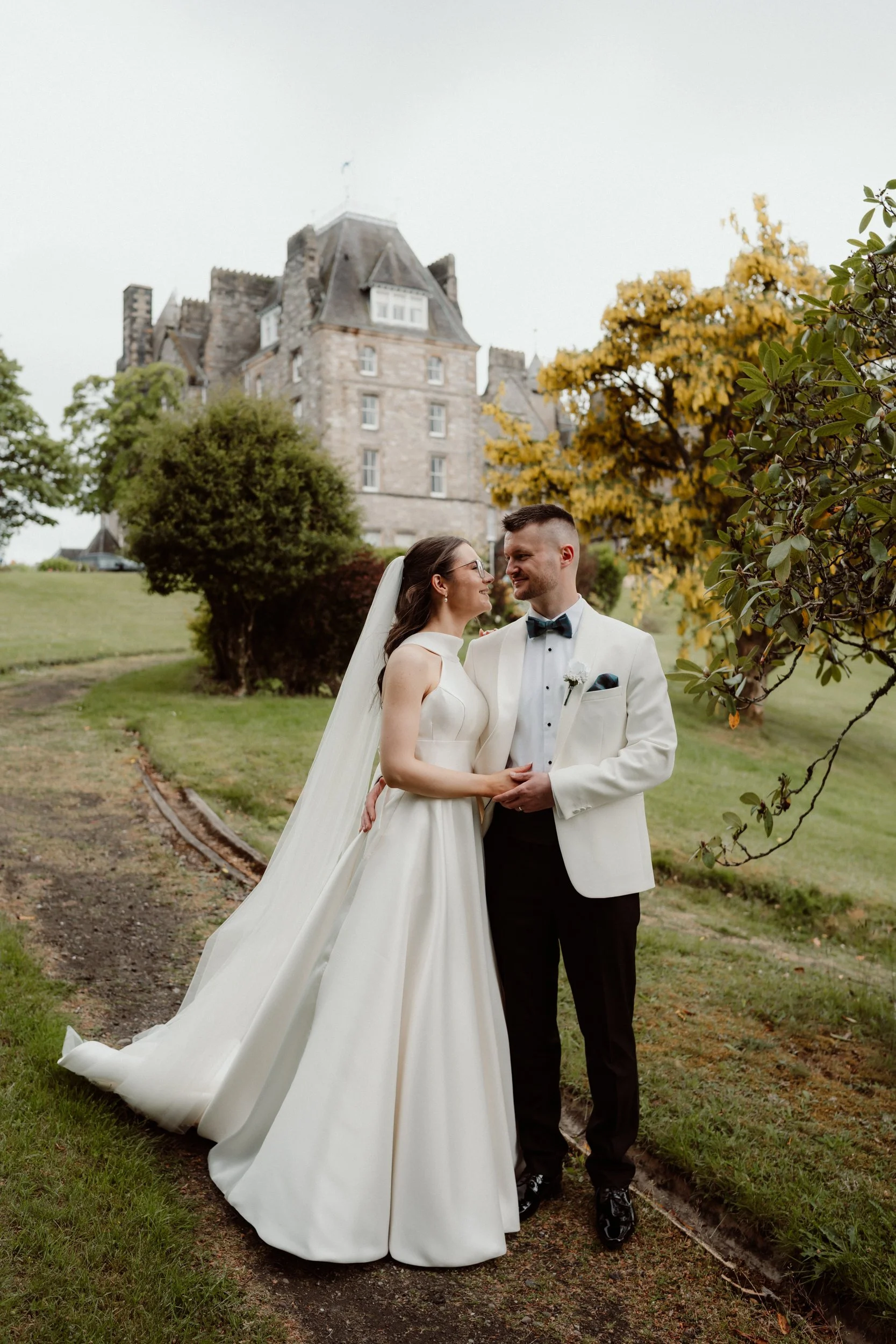 Bride and groom portrait outside Atholl Palace Hotel during an intimate wedding in Pitlochry, Perthshire.