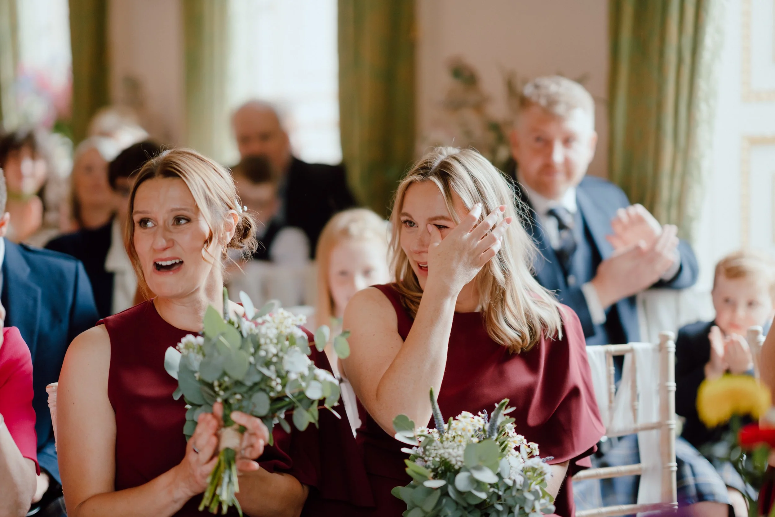 Emotional bridesmaid during ceremony