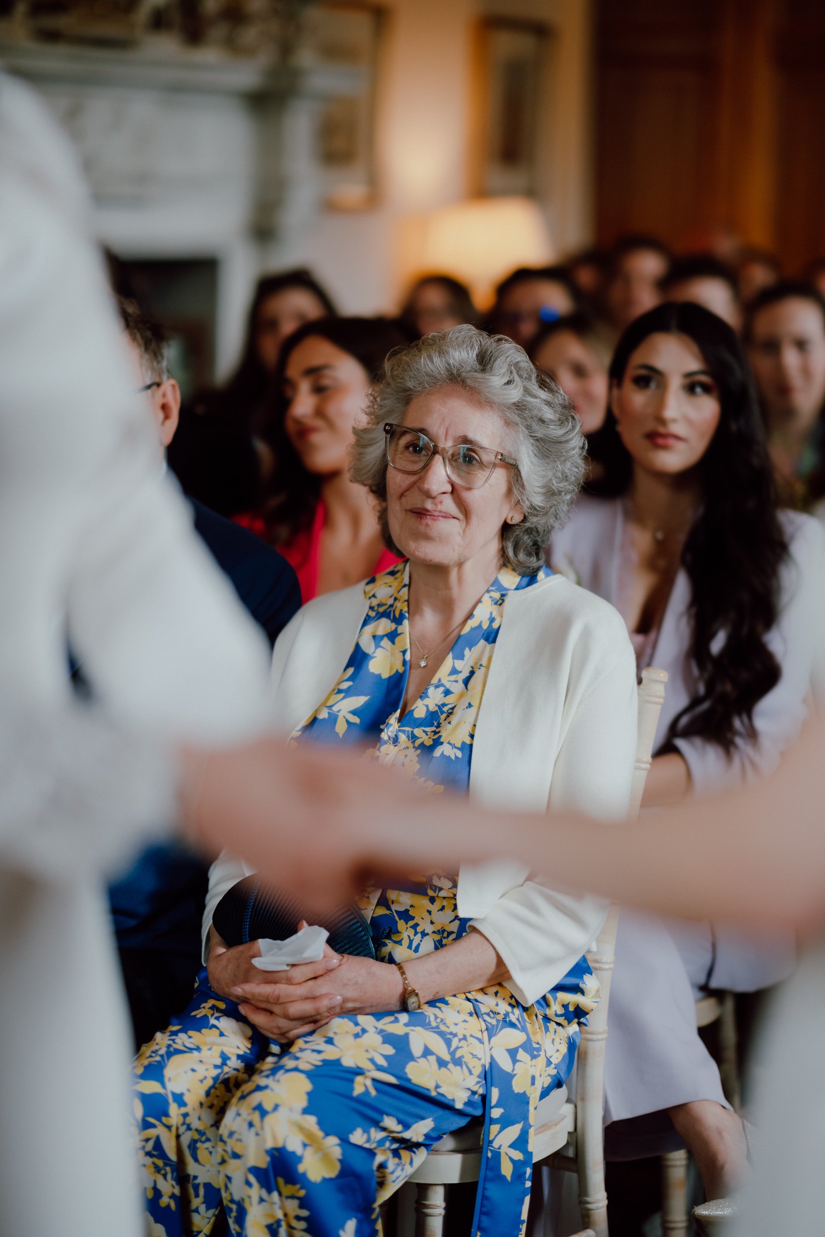 Mother of the bride becoming emotional during a wedding ceremony at Megginch Castle, Scotland.