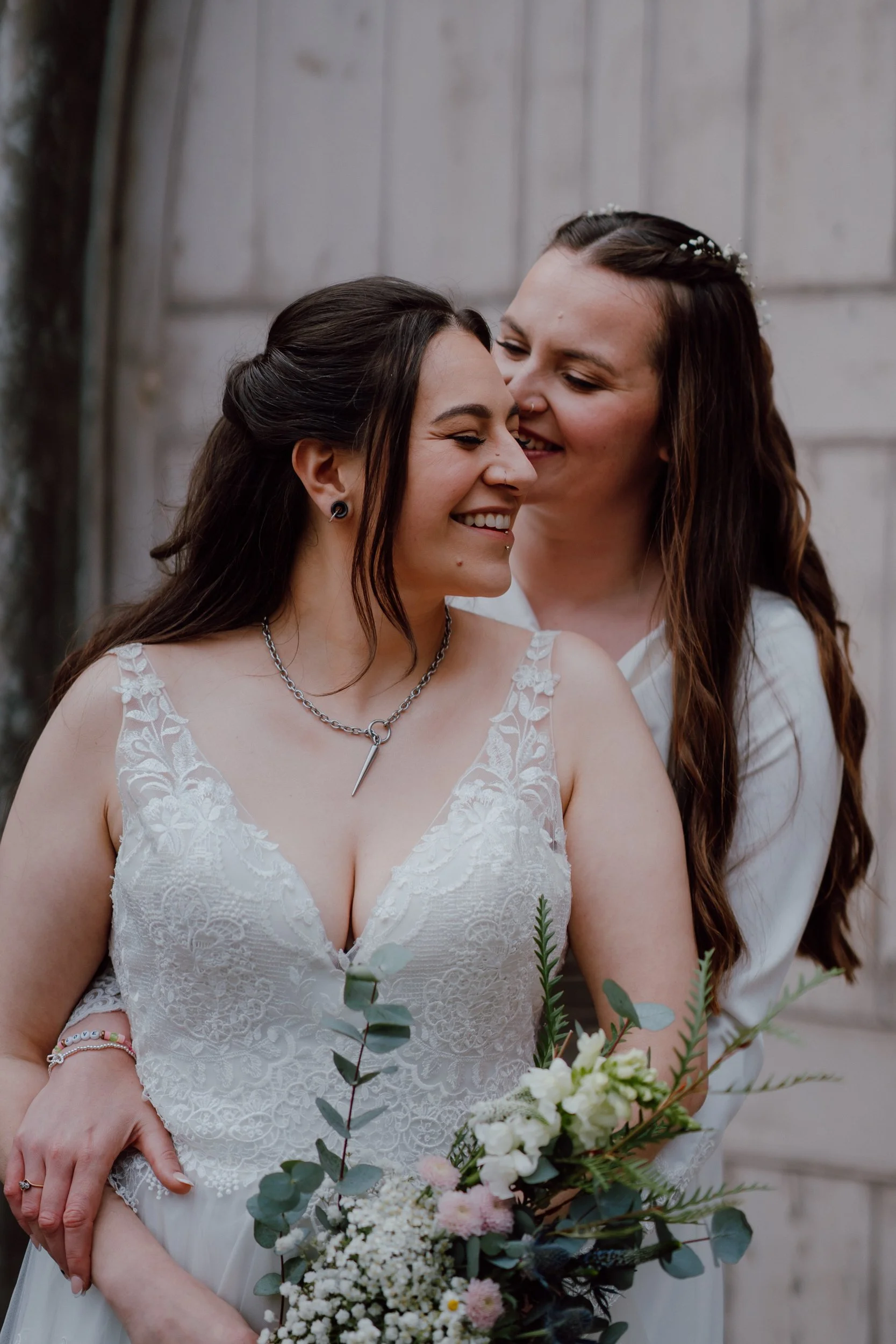 Intimate moment between two brides