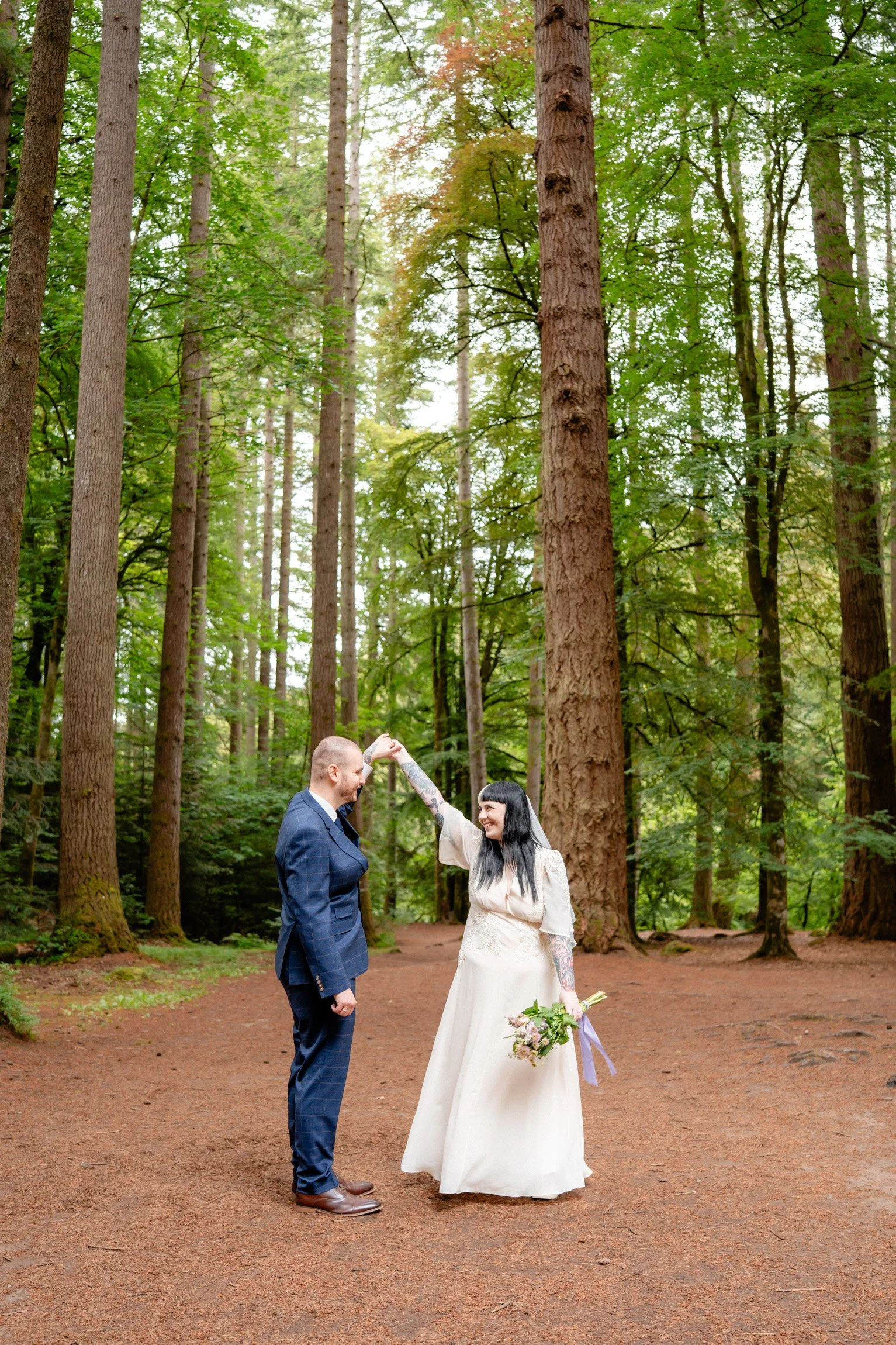 Bride and Groom Dancing in the Forest