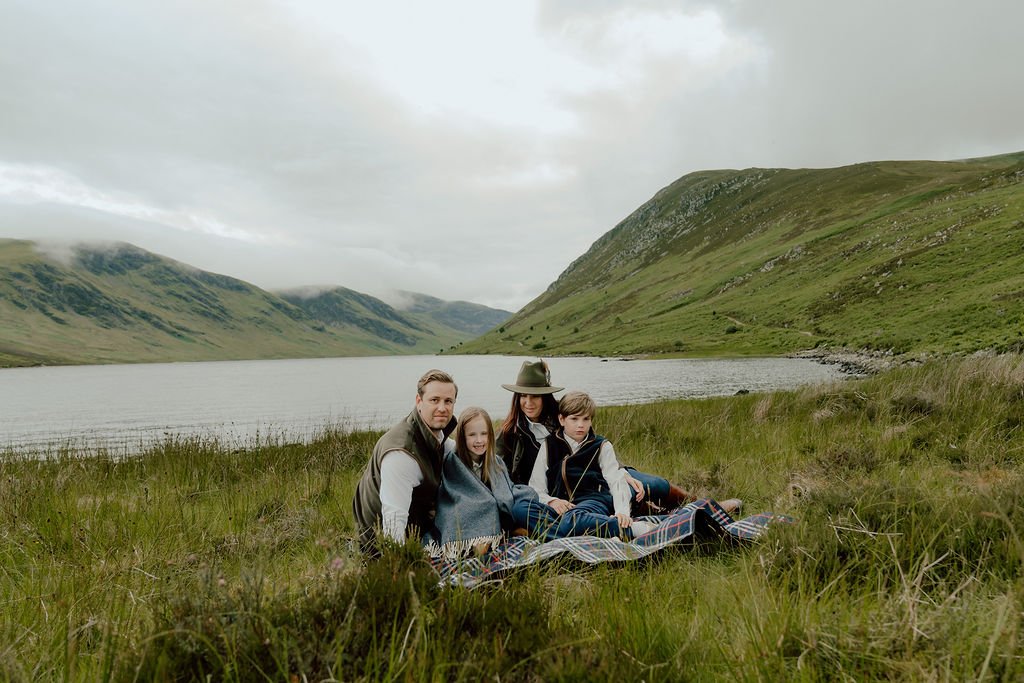 Family by the Loch in the Scottish Highlands