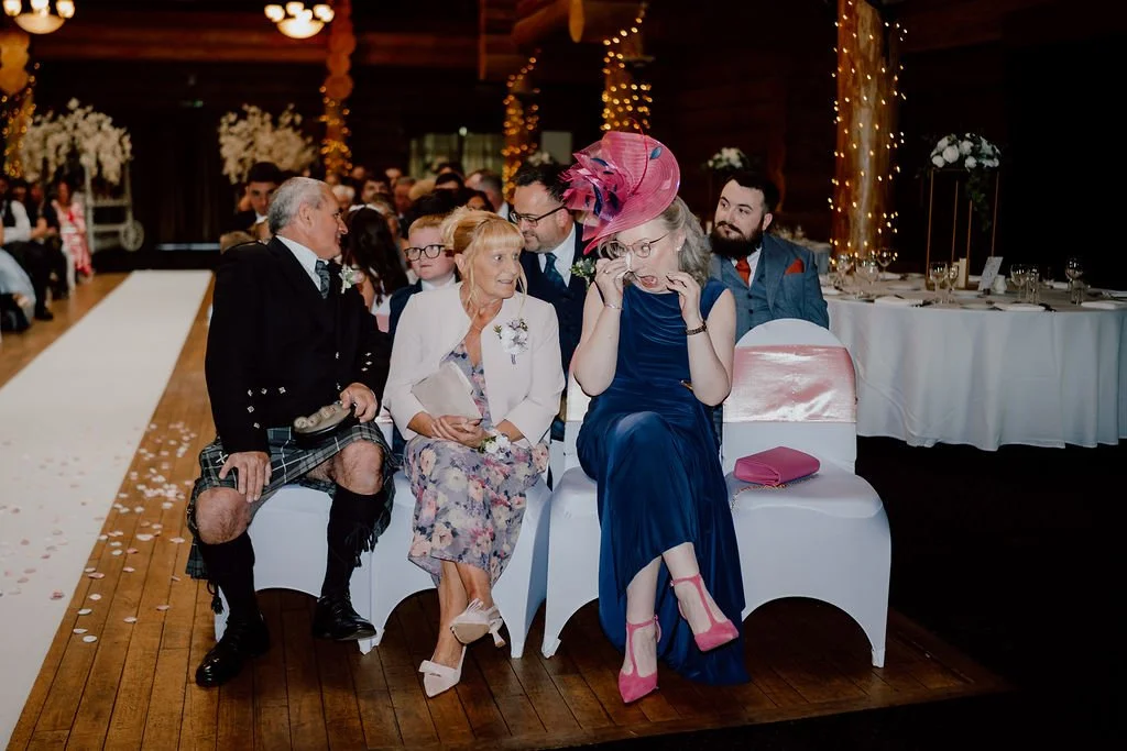 Family and friends sharing a candid moment during the Piperdam wedding reception